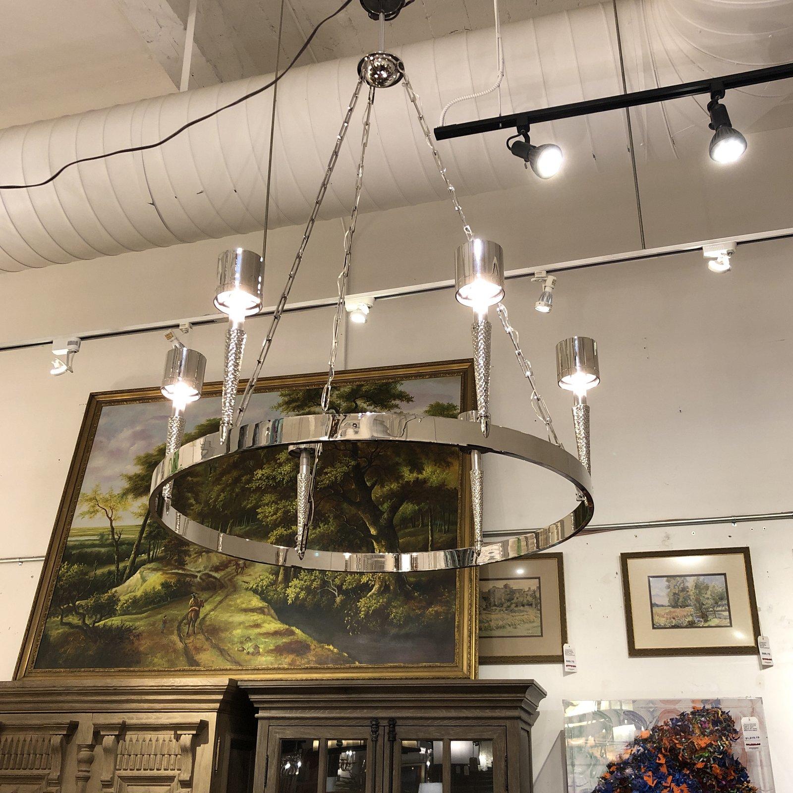 A brand new Garonne chandelier by Jonathan Browning. Straight out of the crate. The Garonne Chandelier is made of solid bronze. The parts have been individually cast from master carvings using the investment cast process. The ceiling plate, stem,
