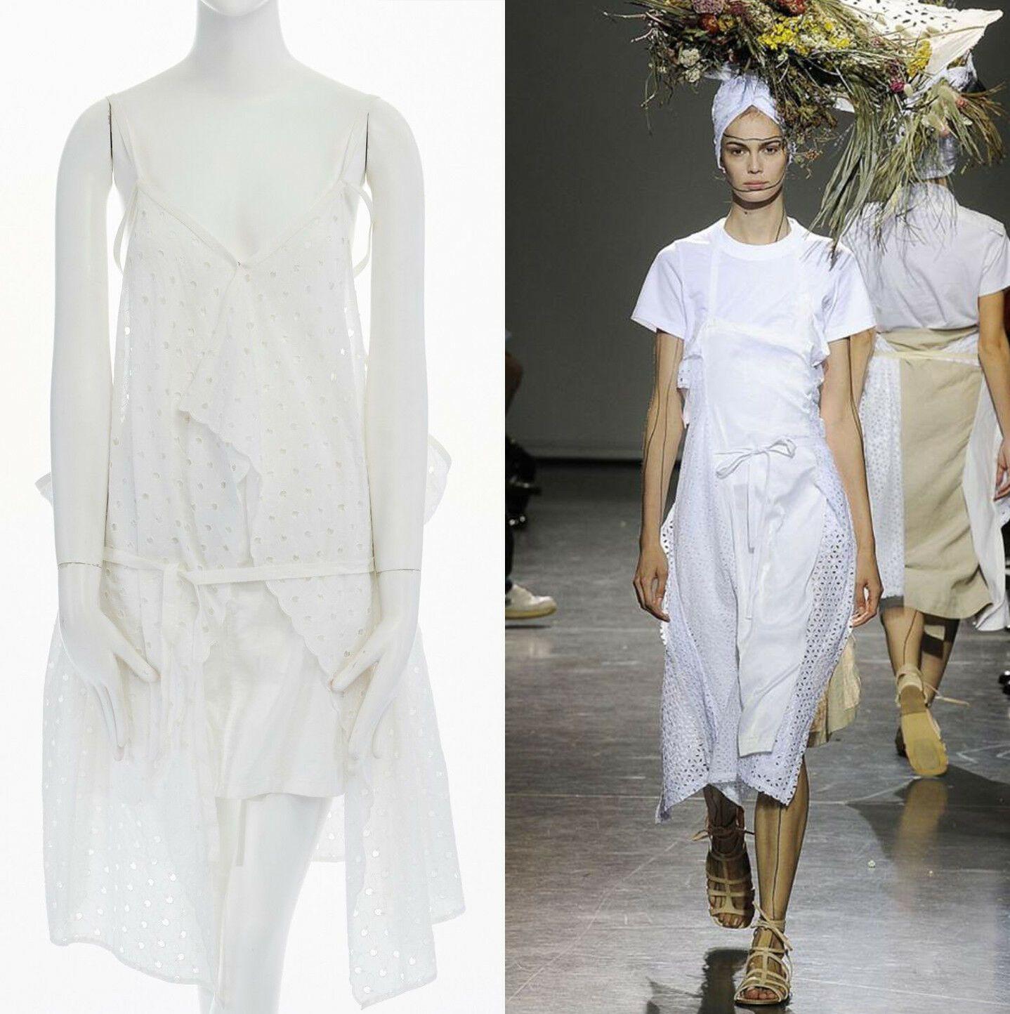 new JUNYA WATANABE 2011 white embroidery anglais open draped front vest dress S

JUNYA WATANABE
SIMILAR STYLE ON 2009 RUNWAY, RE-PRODUCTION IN 2011
Cotton. White. Embroidery anglais. Draped open front. Single hook eye closure at front. Button zip