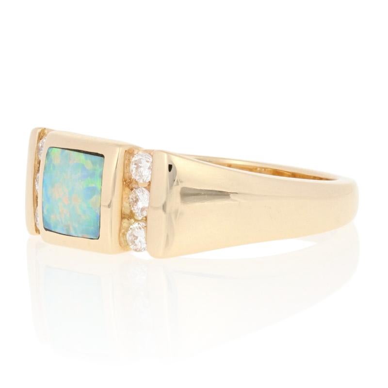 Make this exquisite Kabana ring the highlight of a special birthday or milestone anniversary! Fashioned in classic 14k yellow gold, this NEW piece features an opal in a square, smoothly polished bezel. Six channel-set diamonds on the sides of the