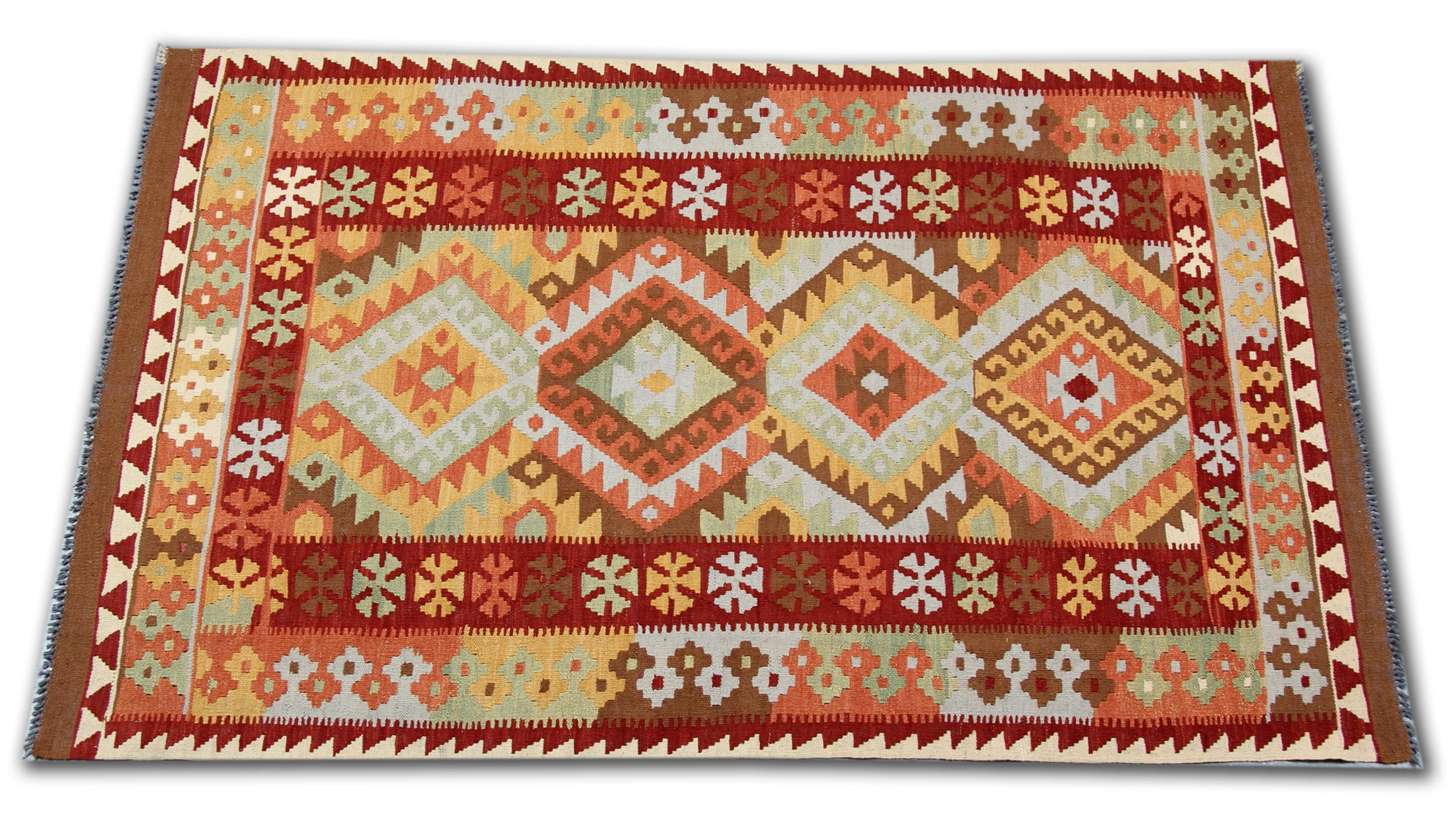 This colourful handmade carpet oriental rug is woven by very skilled weavers in Afghanistan, who used the highest quality wool and cotton. The flat-weave rug has blue, orange, green, white, pink and red colours. The white background of this