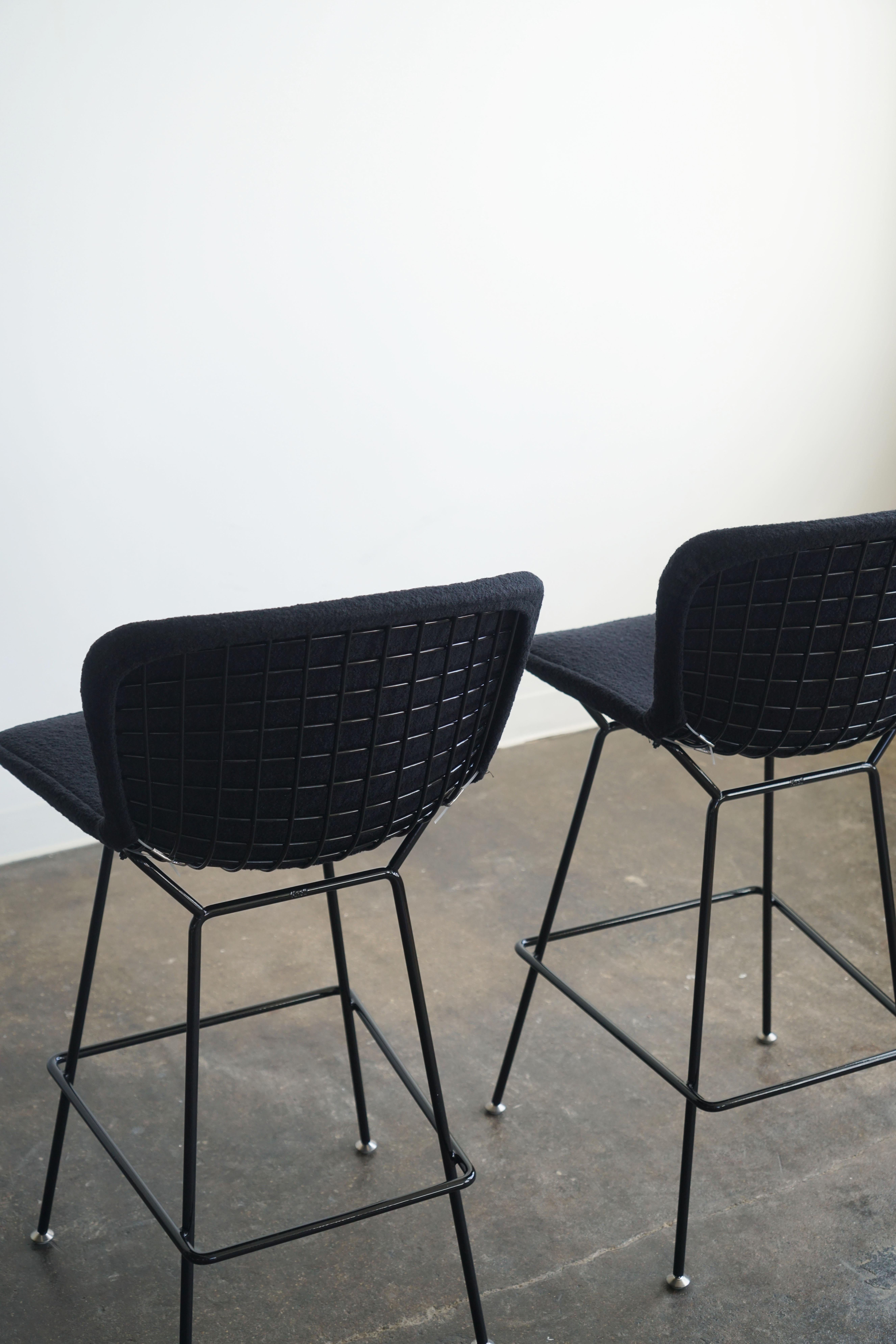 Contemporary New Knoll Bertoia bar stools in black frame with upholstered black boucle, pair 