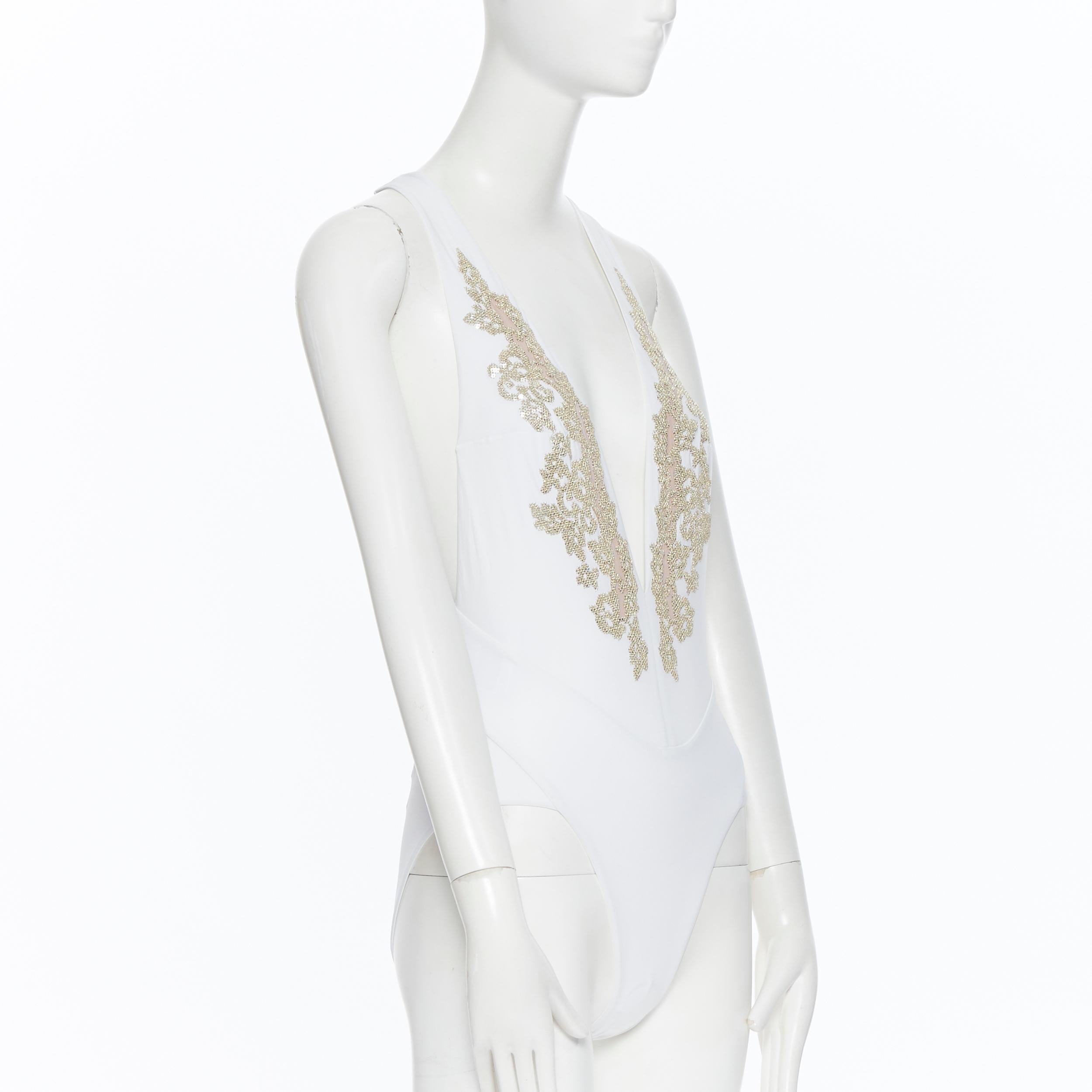 white and gold bodysuit