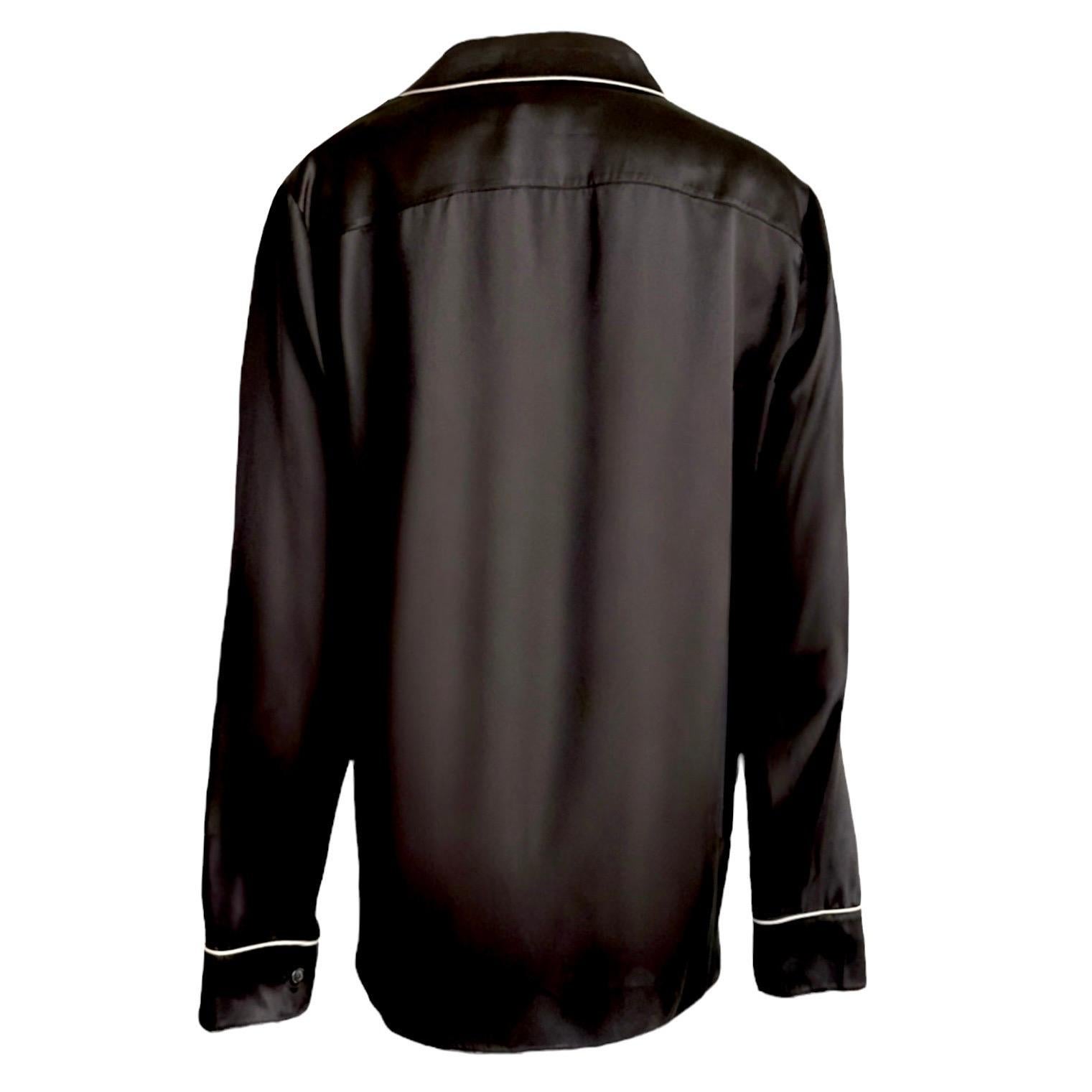 This luxurious LAUREN BY RALPH LAUREN blouse is cut from finest, shimmering back silk. It is cut in a classic, elegant style and is a timeless addition to any wardrobe.

Silk Blouse by Lauren by Ralph Lauren
100% pure silk
Finest black silk
White