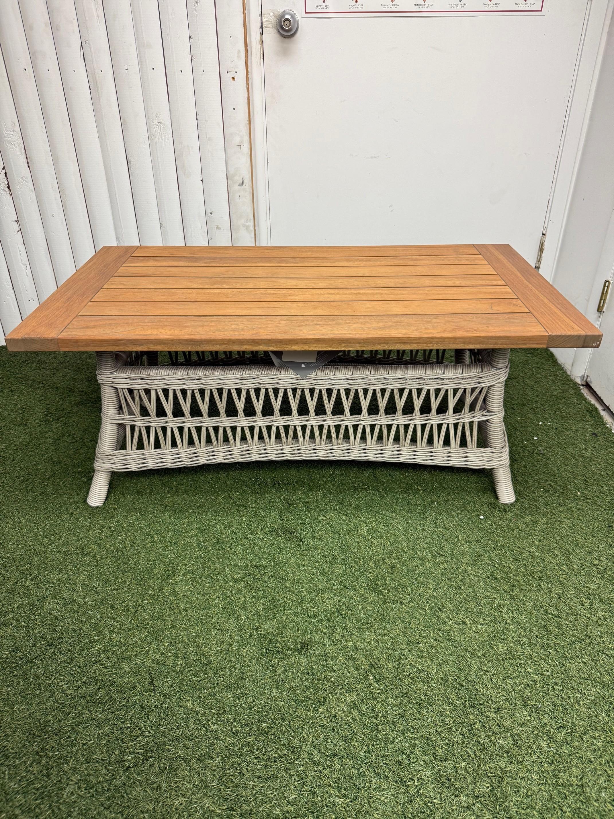 New Lloyd Flanders Mackinac Woven Vinyl Cocktail Table with Teak Top. Ideal for the outdoor lounge or living room arrangement
Table base showcases open weave styling with tighter together round weave edging for contrasting appeal.
Rectangular table