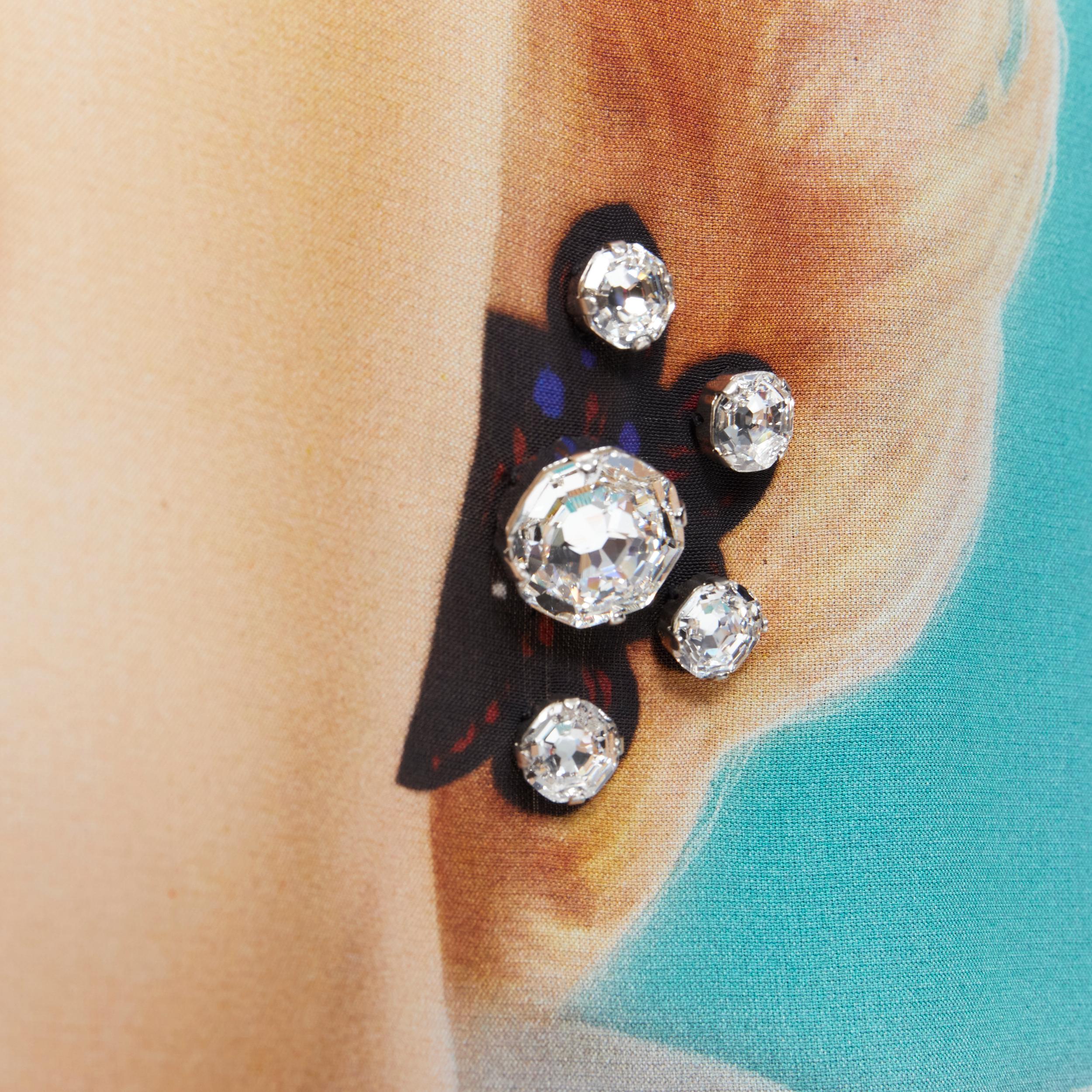 new LOEWE Marilyn Monroe photo print crystal earring wrap skirt FR36 XS 
Reference: TGAS/B01339 
Brand: Loewe
Designer: JW Anderson 
As seen on: Elle Fanning 
Material: Viscose 
Color: Black 
Pattern: Abstract 
Closure: Button 
Extra Detail: Wrap