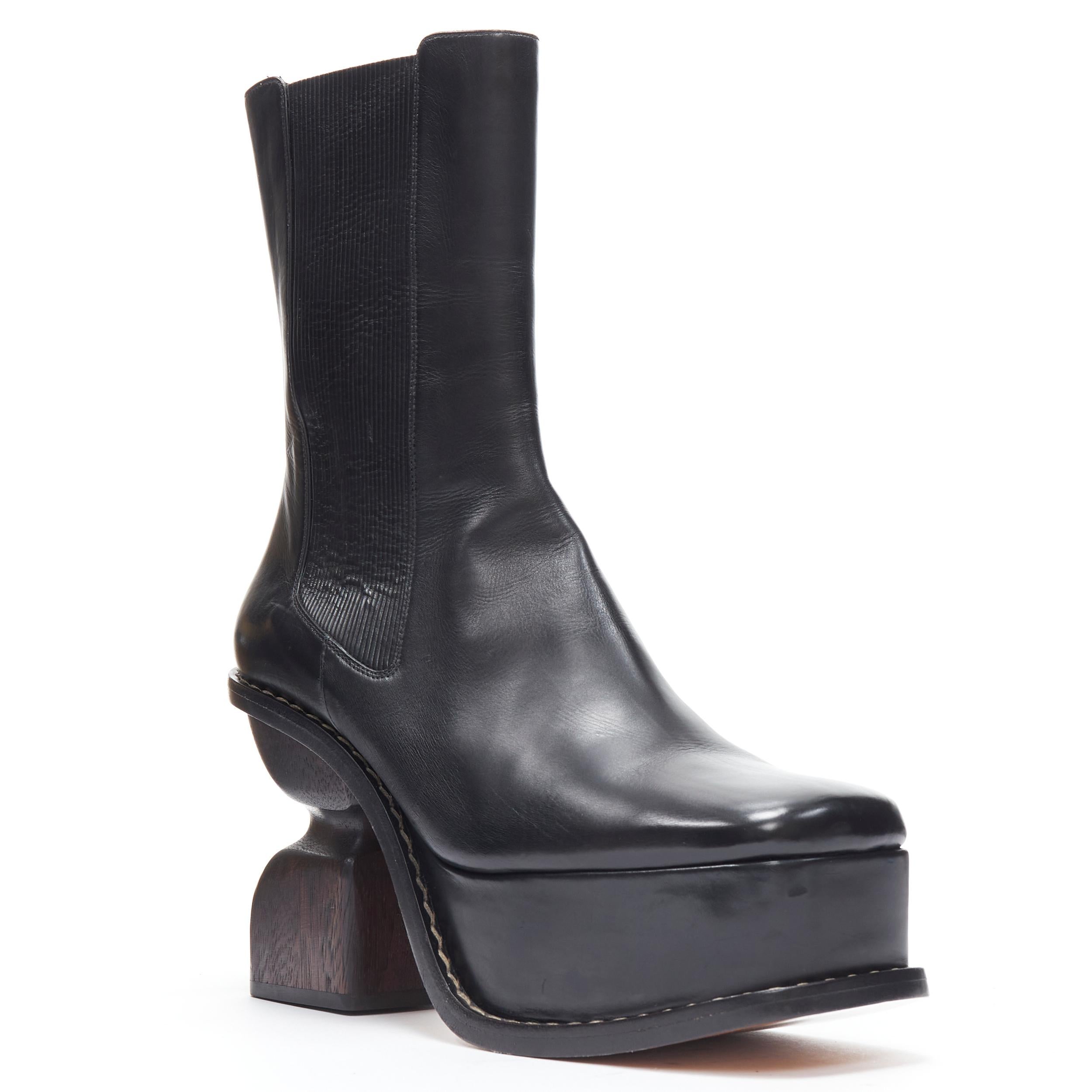new LOEWE Runway sculpted wooden heel platform square toe ankel boot EU39 
Reference: TGAS/B01323 
Brand: Loewe 
Designer: JW Anderson 
Material: Leather 
Color: Black 
Pattern: Solid 
Closure: Stretch 
Extra Detail: Stretch leather gusset. Square