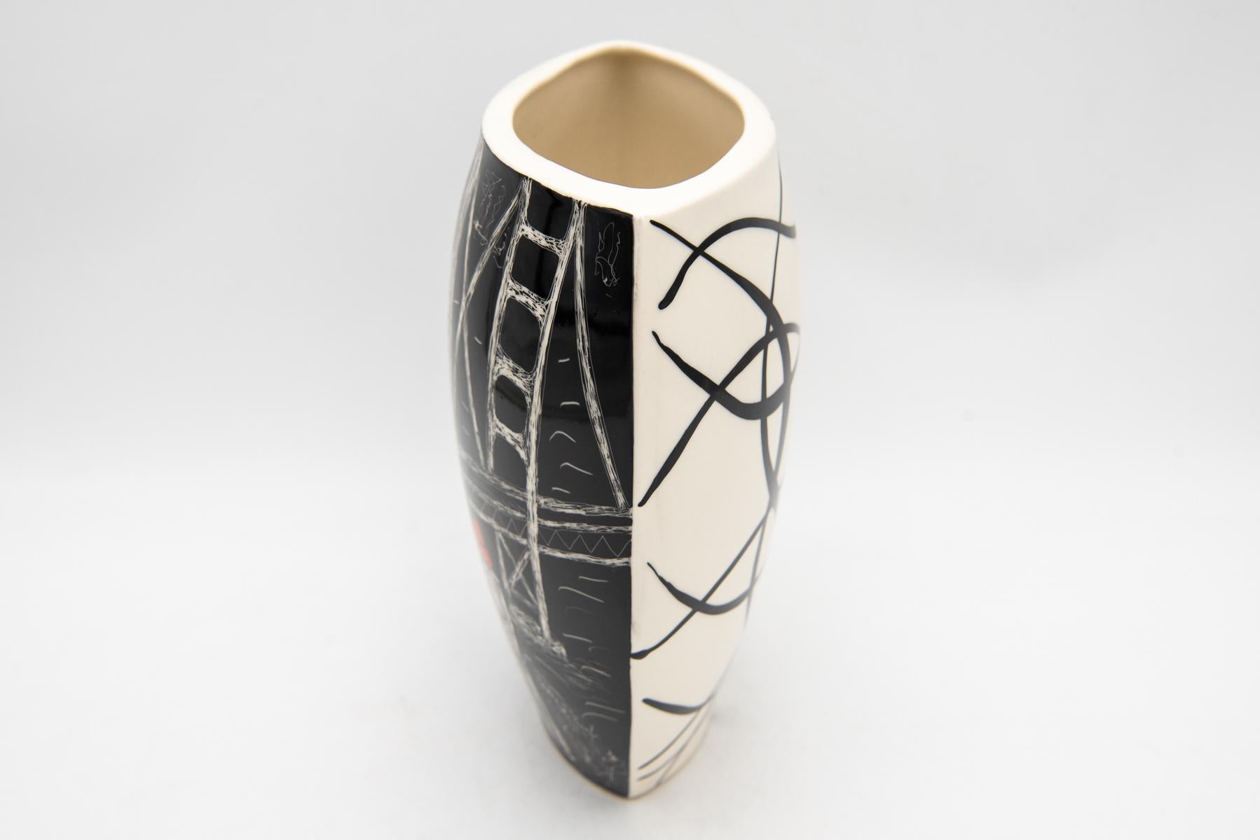 A vase with an interesting shape with abstract decoration in the style of the Polish New Look from the 1960s

Signed on the bottom 