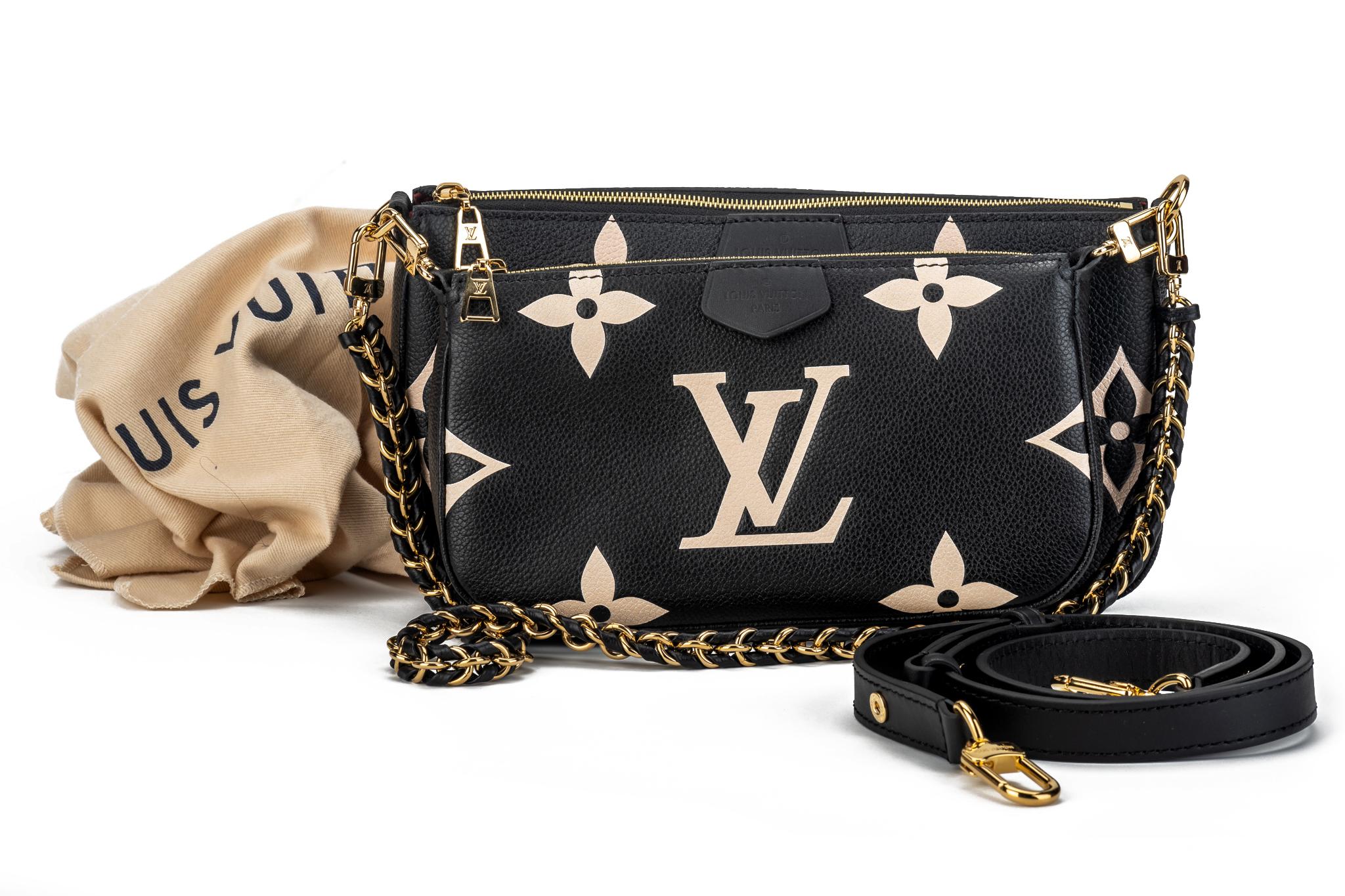 Louis Vuitton leather monogram embossed multi pochette, black with blush inserts with gold tone hardware. Can be worn three ways, separating the two bags and alternating the straps. Brand new with dust cover and original box.