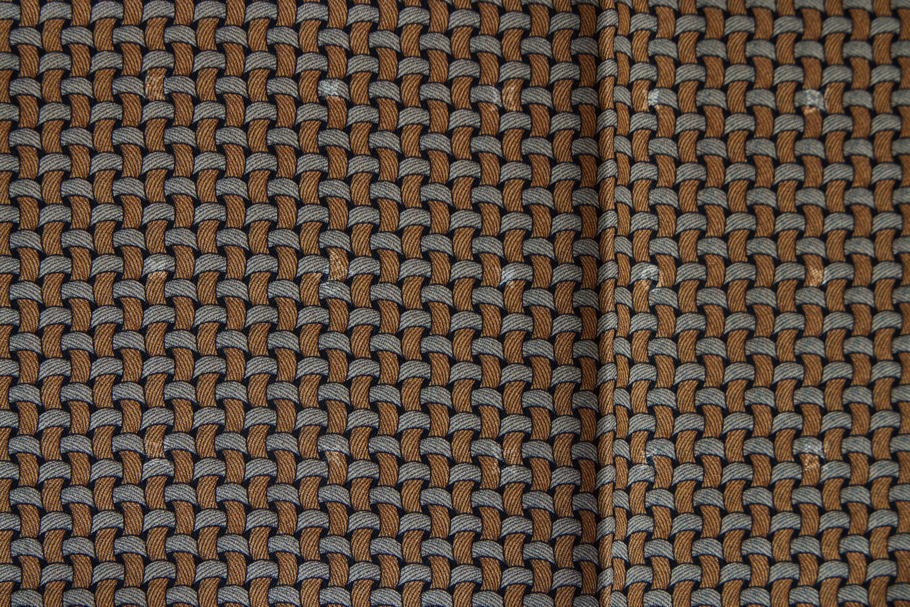 Louis Vuitton brand new silk pocket square in woven blue and rust pattern . Hand rolled edges.