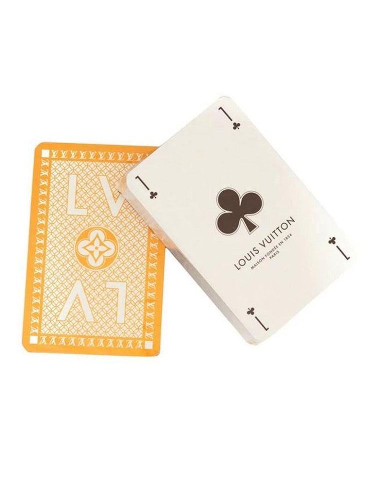 Lot - A Louis Vuitton Monogram two-pack playing cards with case