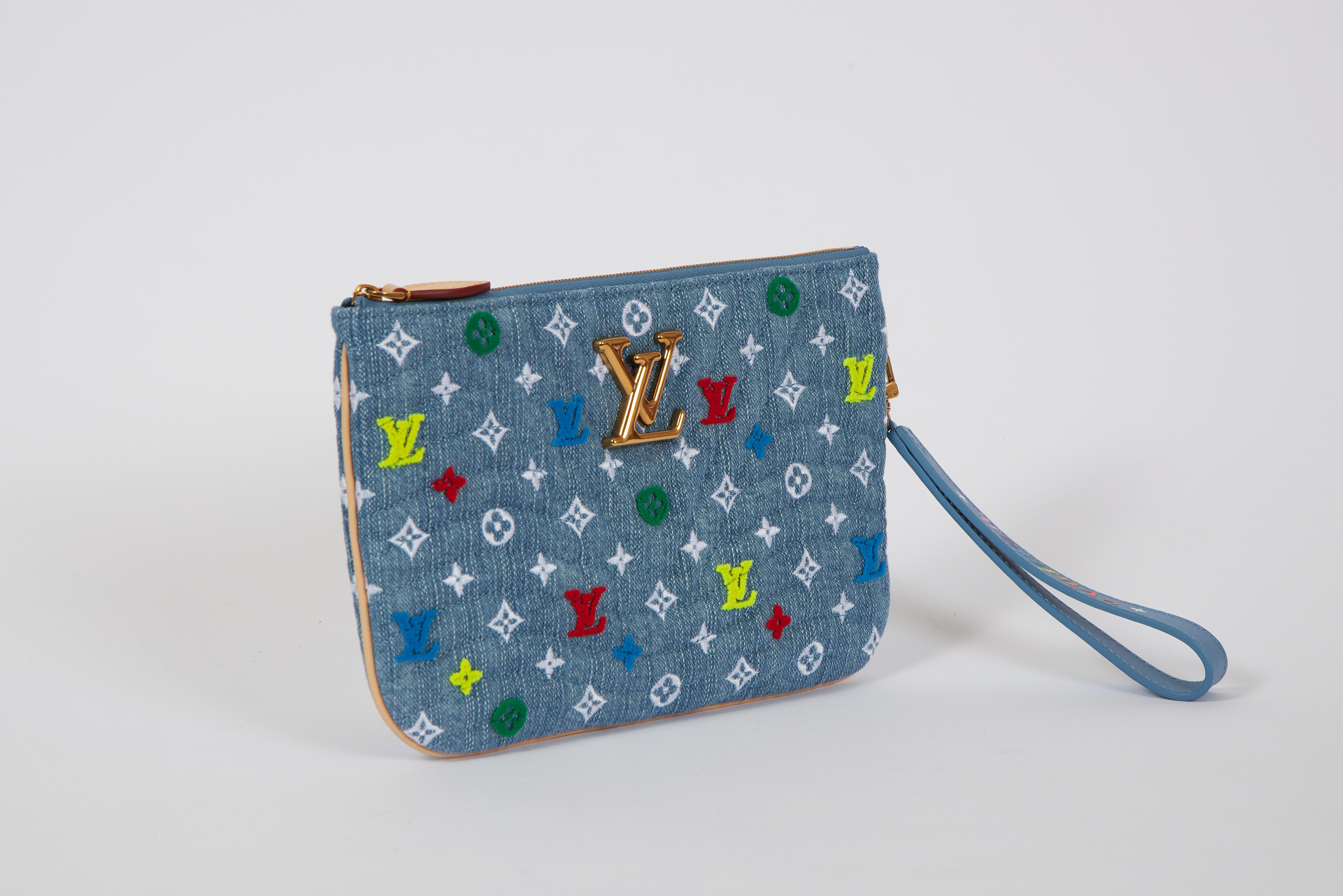 Louis Vuitton limited edition denim pouchette with multicolor logo. detachable handle. Comes with booklet, dust cover, original box and ribbon.