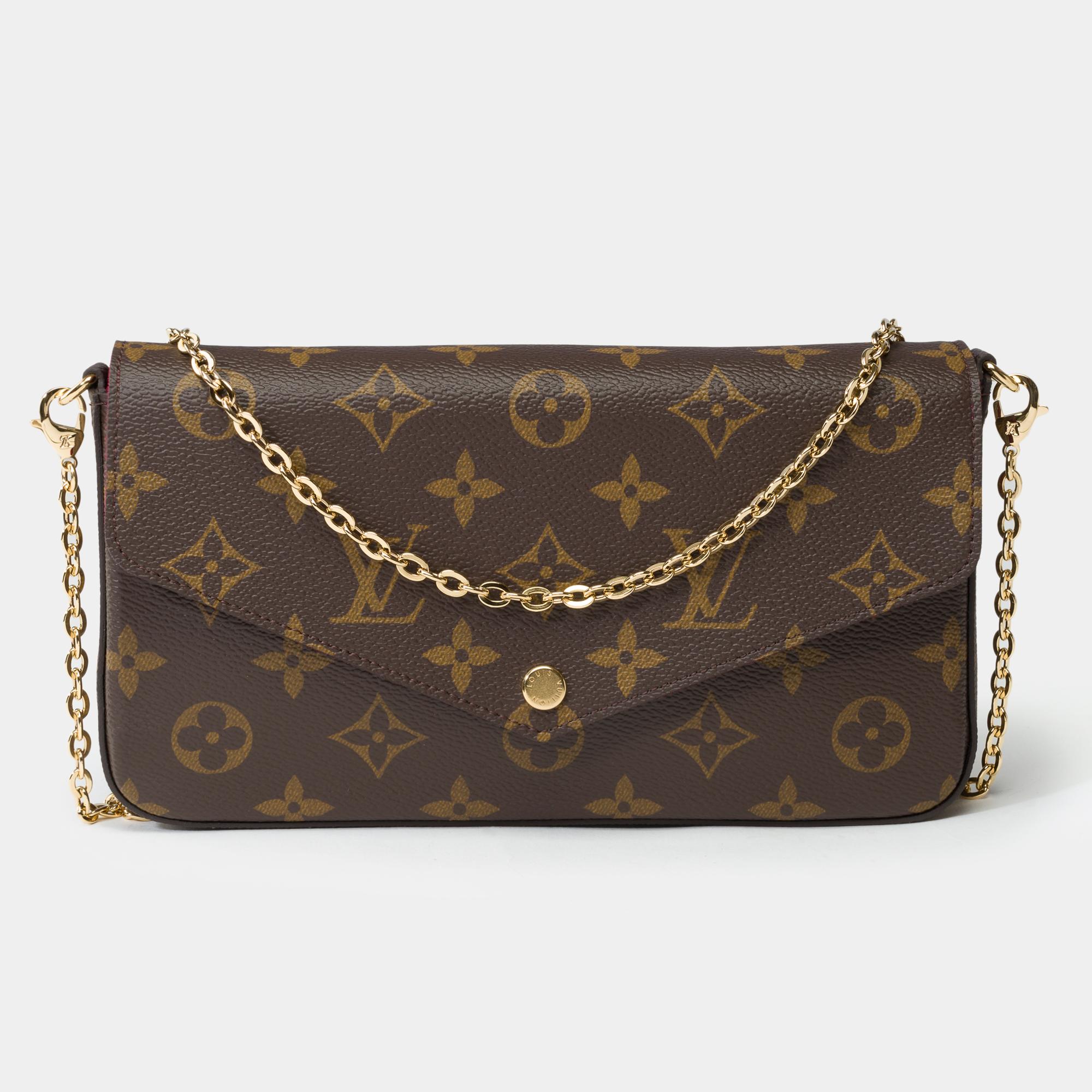 Designed​​ ​​to​​ ​​be​​ ​​worn​​ ​​in​​ ​​different​​ ​​ways,​​ ​​this​​ ​​Félicie​​ ​​pouch​​ ​​with​​ ​​Monogram​​ ​​canvas​​ ​​flap​​ ​​is​​ ​​lined​​ ​​with​​ ​​fuchsia​​ ​​microfiber.​​ ​​The​​ ​​interior​​ ​​features​​ ​​two​​ ​​removable​​