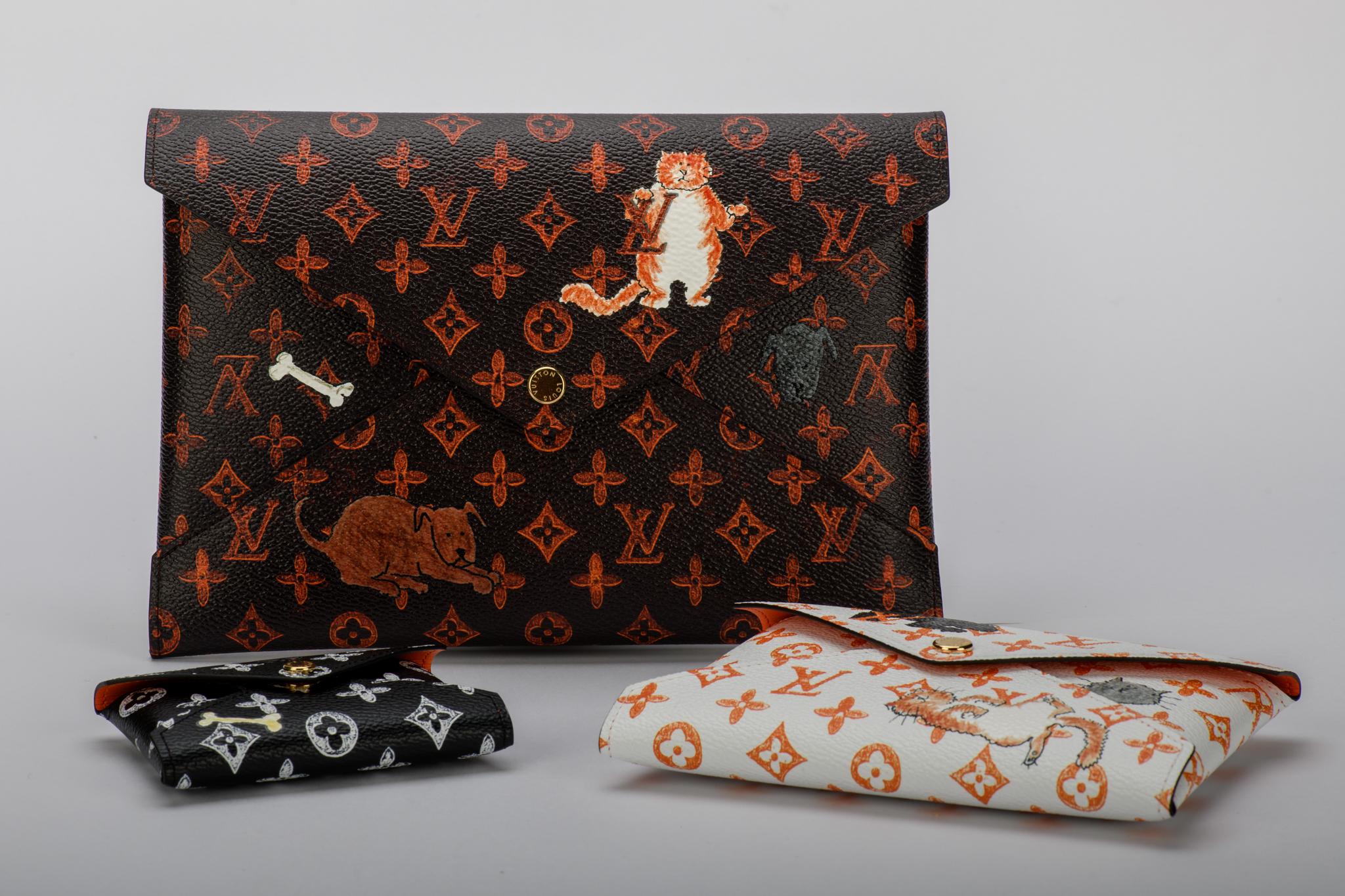 Sold out in stores! New Louis Vuitton Grace Coddington set of three clutches with cats design. Cruise 2019 collection. Comes with booklet, dust cover and box.
