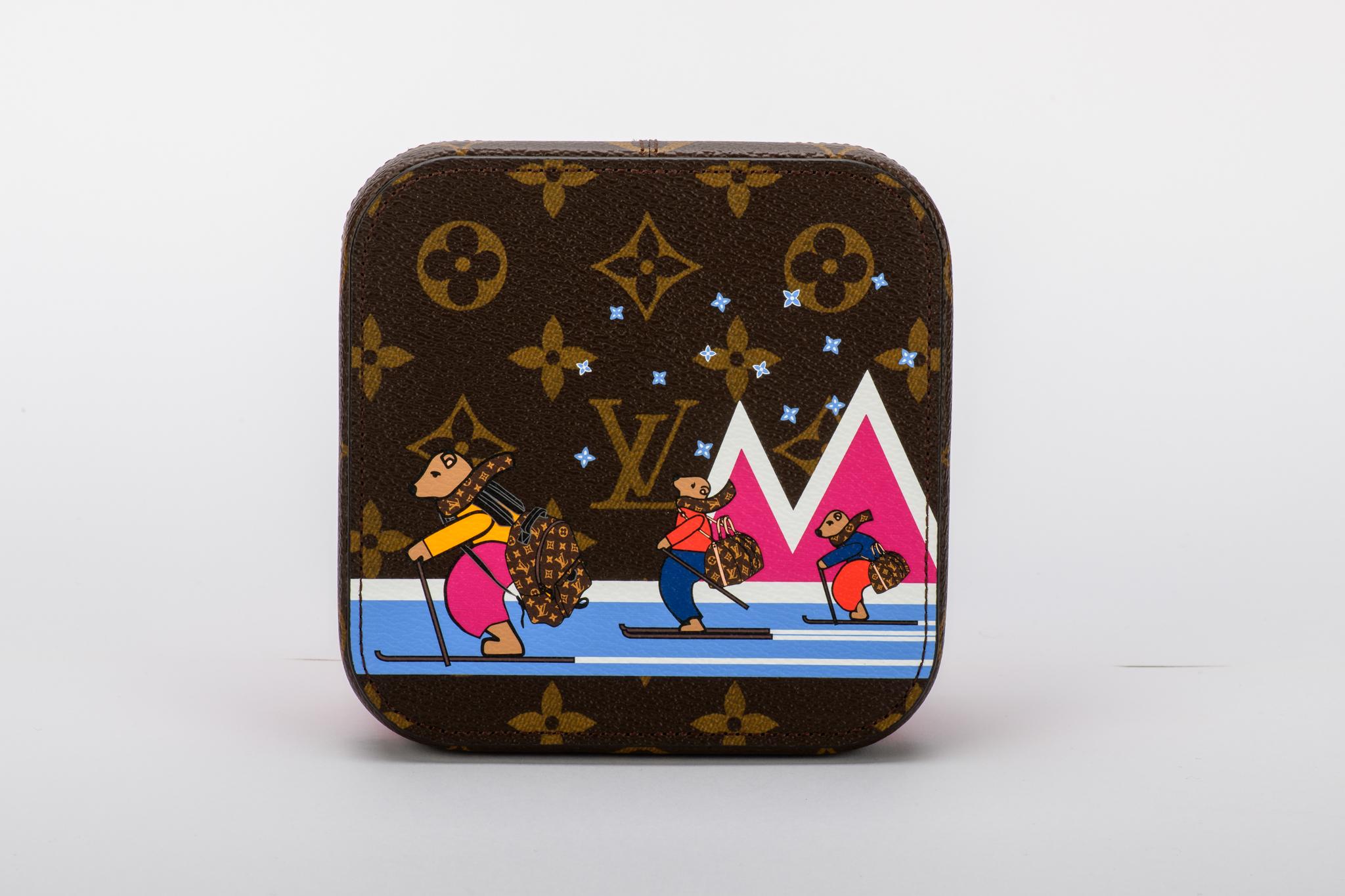 Louis Vuitton Christmas 2018 limited edition skiing bears box. Monogram top and pink leather bottom. Comes with original dust cover and box.
