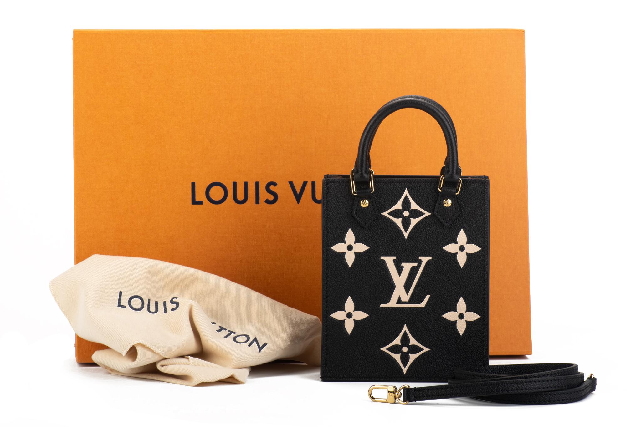 Louis Vuitton limited edition petit sac in black leather with oversize powder pink logo inlay. Gold tone hardware.Detachable strap drop 21