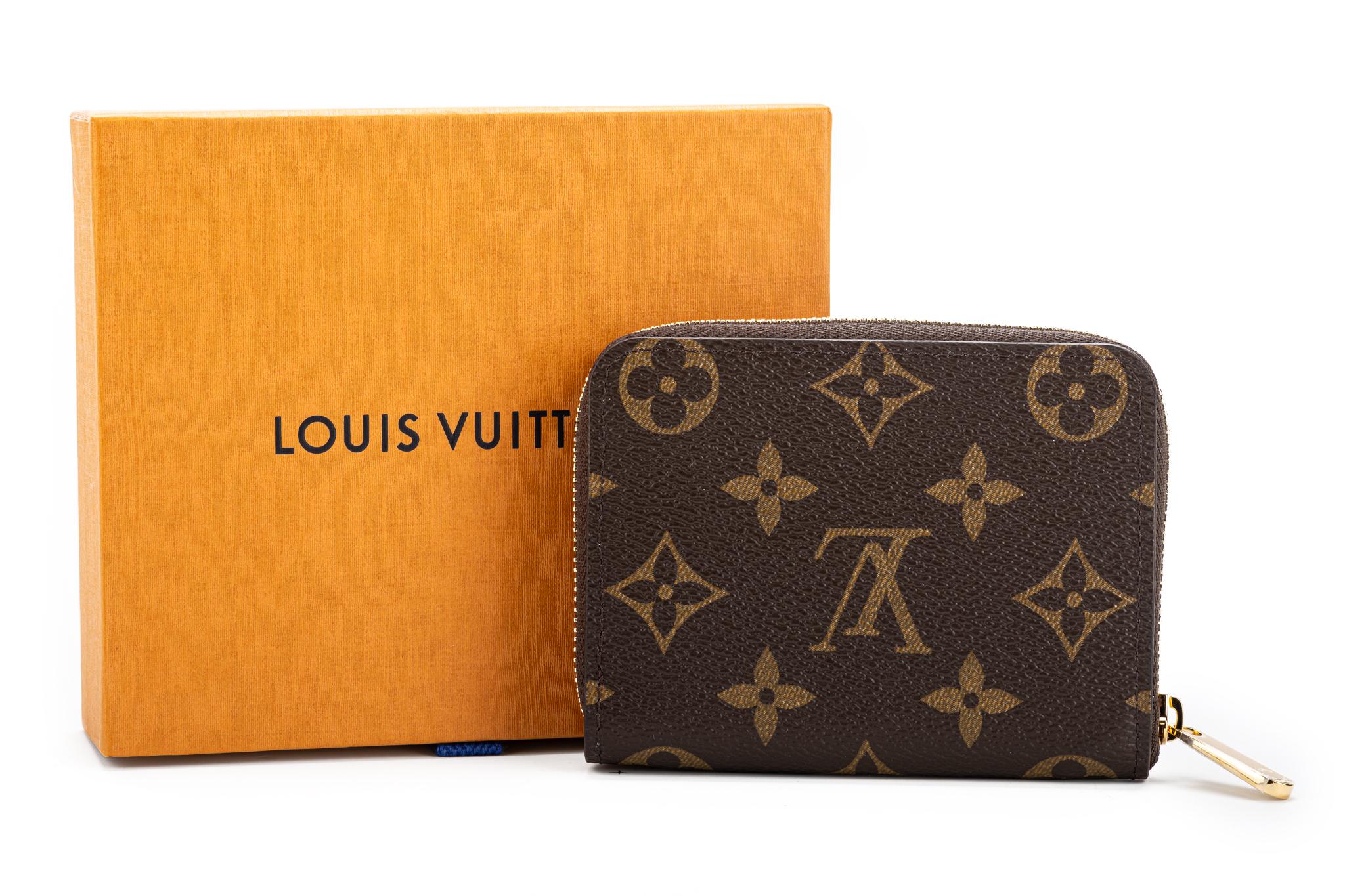 For Christmas 2020, Louis Vuitton's Vivienne mascot stars on an exclusive edition of the Zippy coin purse in Monogram canvas at the Luna Park. Brand new in box with original dust cover.