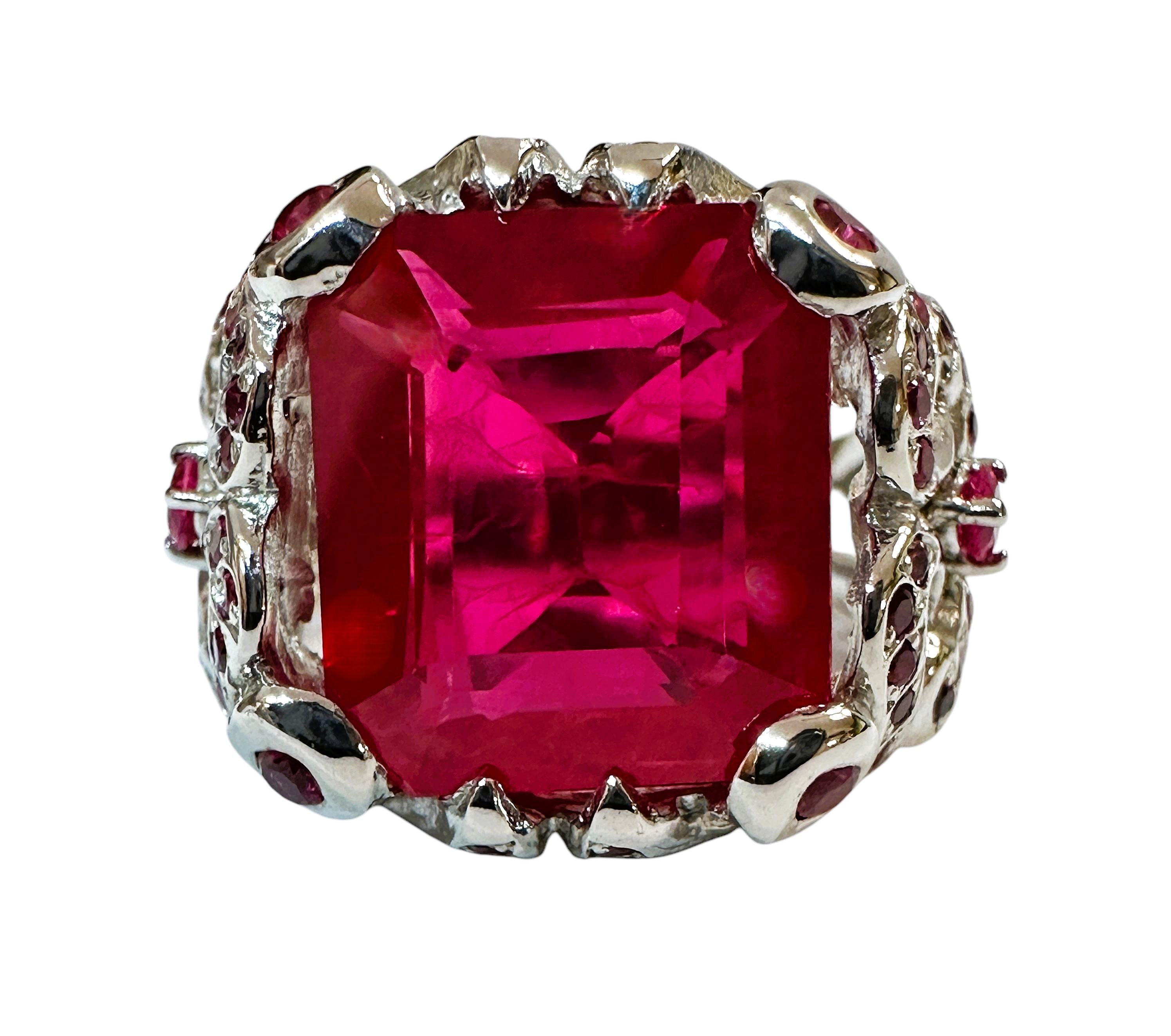 What beautiful stone in this ring!  The ring is a size 6.5.  The stone is from Africa and is just exquisite.  It is a highly rated stone.  It is a fancy cut asscher cut stone and is 11.7 Cts   The main stone is 13 mm x 12 mm and it is surrounded by