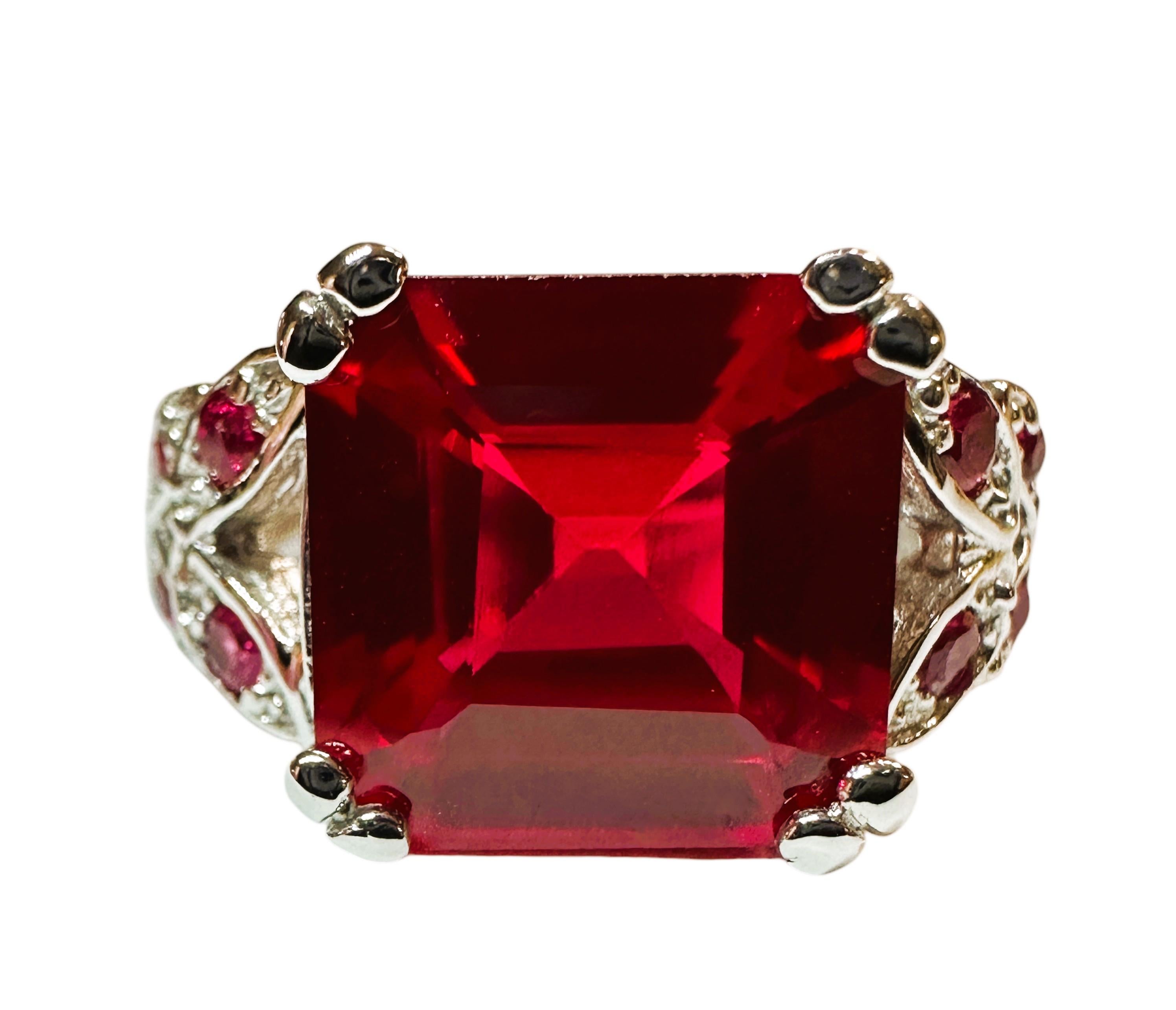 What a gorgeous ring! The ring is a size 6.  The stone is from Africa and is just exquisite.  It is a square cut stone and is 5.90 Ct   The main stone is 10.8 x 10.8 mm and has 4 diamond cut red sapphires on either side of the band.  The ring is
