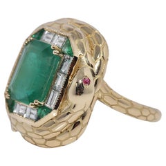 Anillo de oro de 18 quilates con diamante natural talla baguette y esmeralda con diseño de serpiente