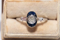 Anello in oro 18k di nuova produzione con diamante Nature Old Cut e zaffiro Calibro Cut