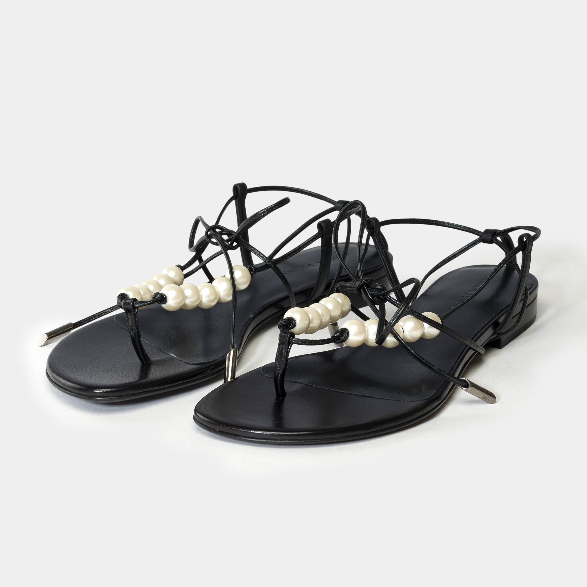 A​ ​simple​ ​flat​ ​sandal​ ​with​ ​strappy​ ​detailing.​ ​Reflecting​ ​the​ ​seasonal​ ​motives​ ​and​ ​brand's​ ​craft​ ​pearl​ ​beads​ ​are​ ​the​ ​newest​ ​detail
Upper​ ​Gros​ ​Grain​ ​100%​ ​Viscose​ ​Insole,​ ​Sole:​ ​100%​ ​Calf​