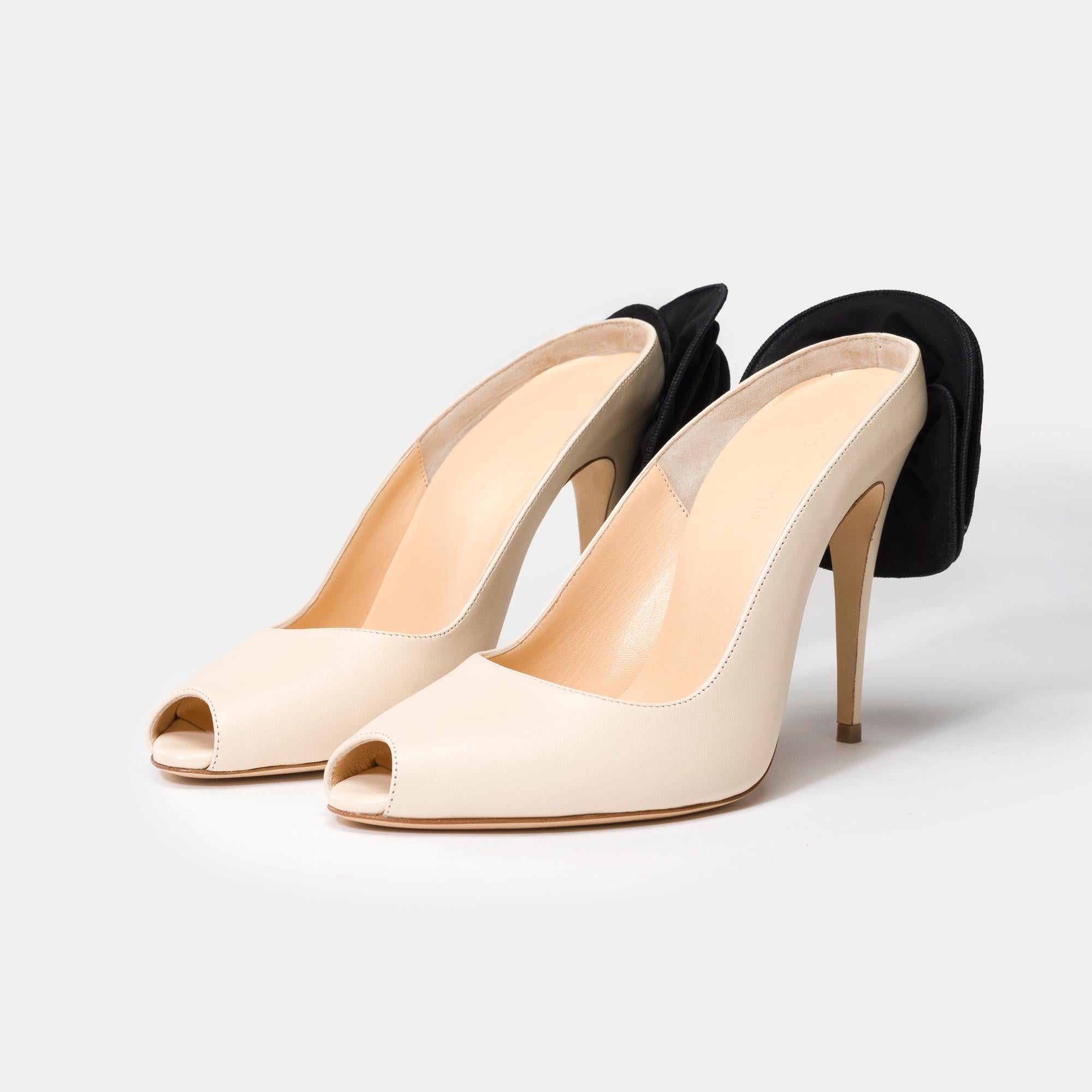 Made​ ​in​ ​Italy,​ ​these​ ​peep​ ​toe​ ​mules​ ​are​ ​set​ ​atop​ ​a​ ​105mm​ ​heel​ ​and​ ​feature​ ​Magda's​ ​signature​ ​3D​ ​flower​ ​at​ ​the​ ​heel
Upper​ ​100%​ ​Calf​ ​Leather.​ ​Insole,​ ​Sole:​ ​100%​ ​Calf​ ​leather.​ ​Flower​ ​100%​