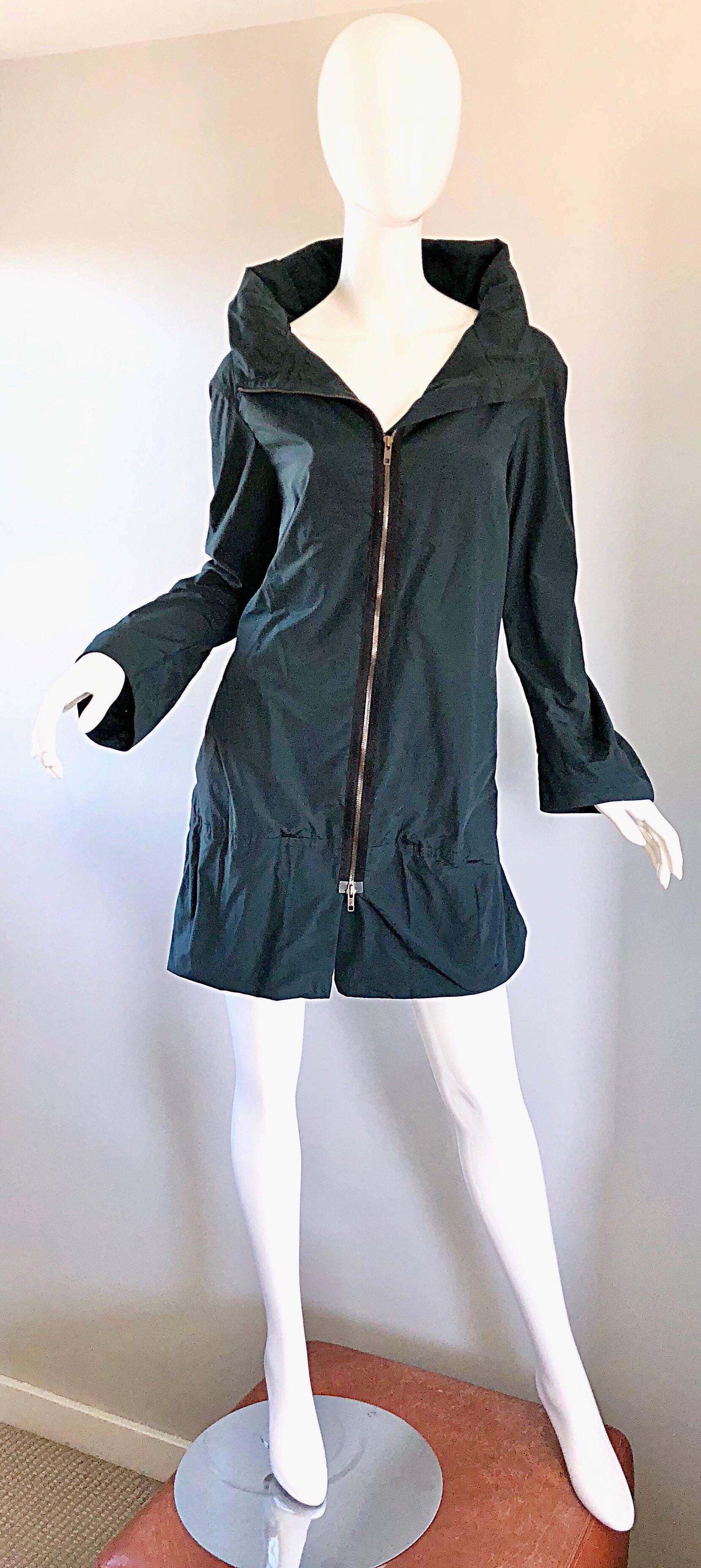 New chic early 2000s MARNI dark forest green parka rain jacket! Features a large oversized shawl collar that can be zipped all the way to the neck, or left open. Pockets at each side of the waist. 
A timeless must have for any fashionista that wants