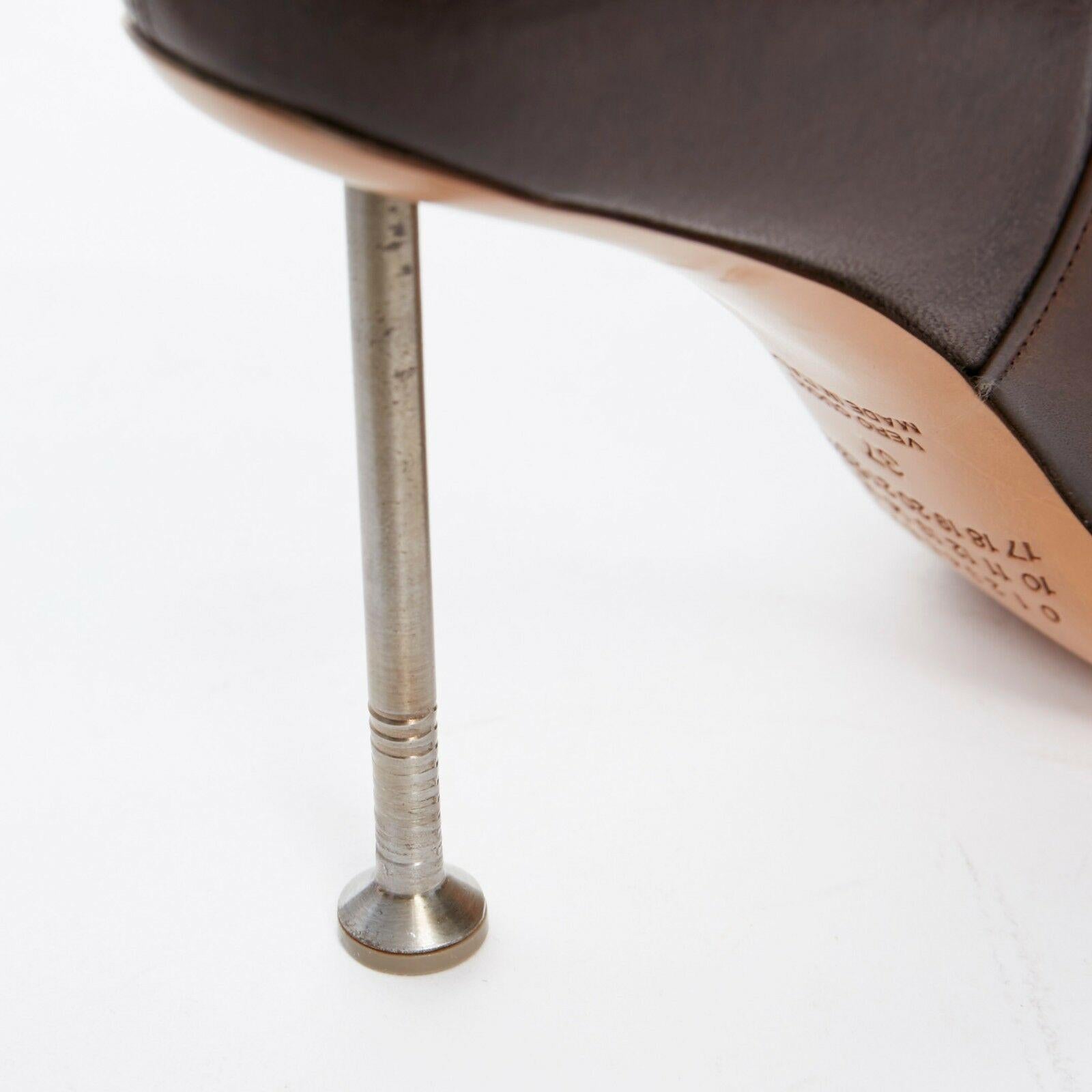 new MARTIN MARGIELA brown leather nail heel ankle boot shoe EU37 US7

MAISON MARTIN MARGIELA
Brown stiff structured leather front . Soft strech leather lining and back . Oversized dual cuff effect when worn . Rounded almond toe . Oversized metal
