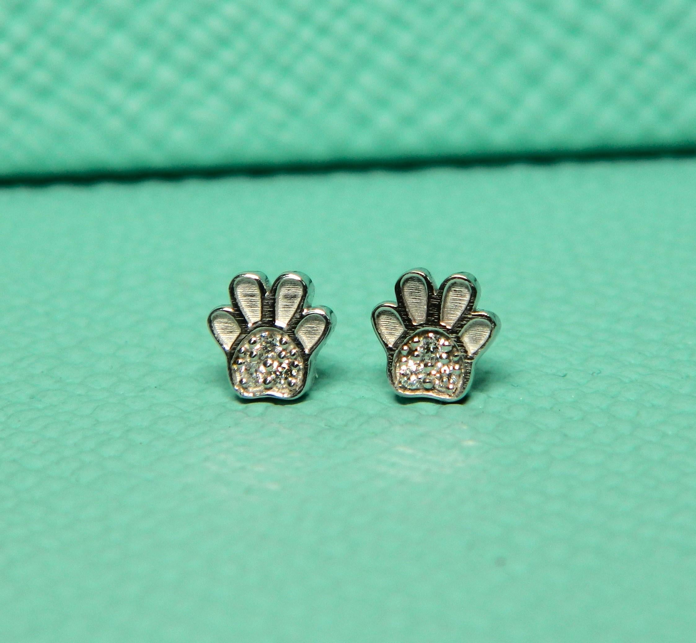 New adorable mini earring stack paw print earrings in 14K white gold and diamonds. For the animal lover and multi piercings, these will get noticed. They are less than 1/4