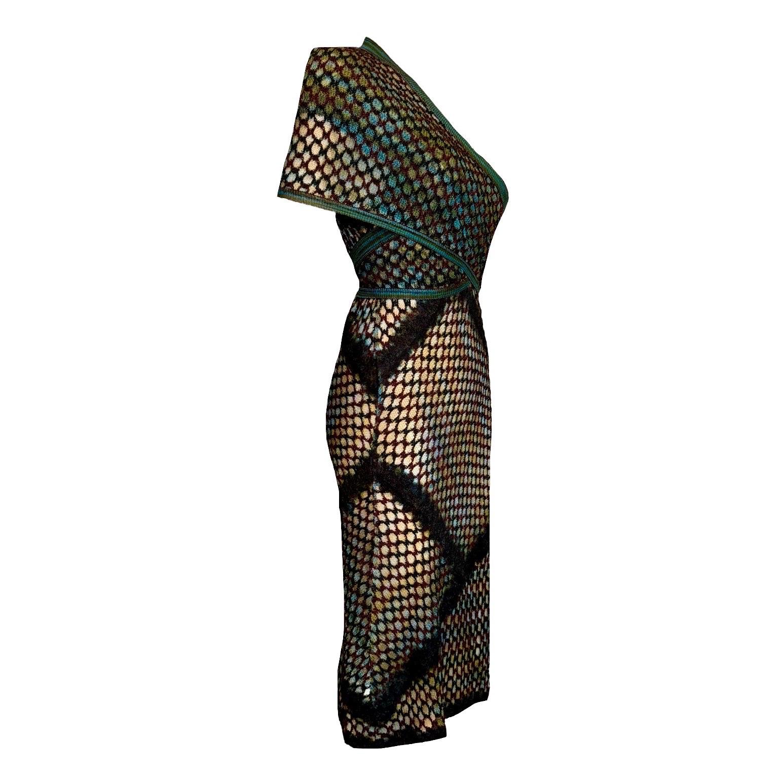 A very unique and sexy evening gown by Missoni - make an entrance with this stunning piece!

DETAILS:

A fantastic Missoni Crochet Knit Ensemble
Consisting of 2 pieces - the dress and matching shrug cardigan
MISSONI main line
Classic MISSONI chevron