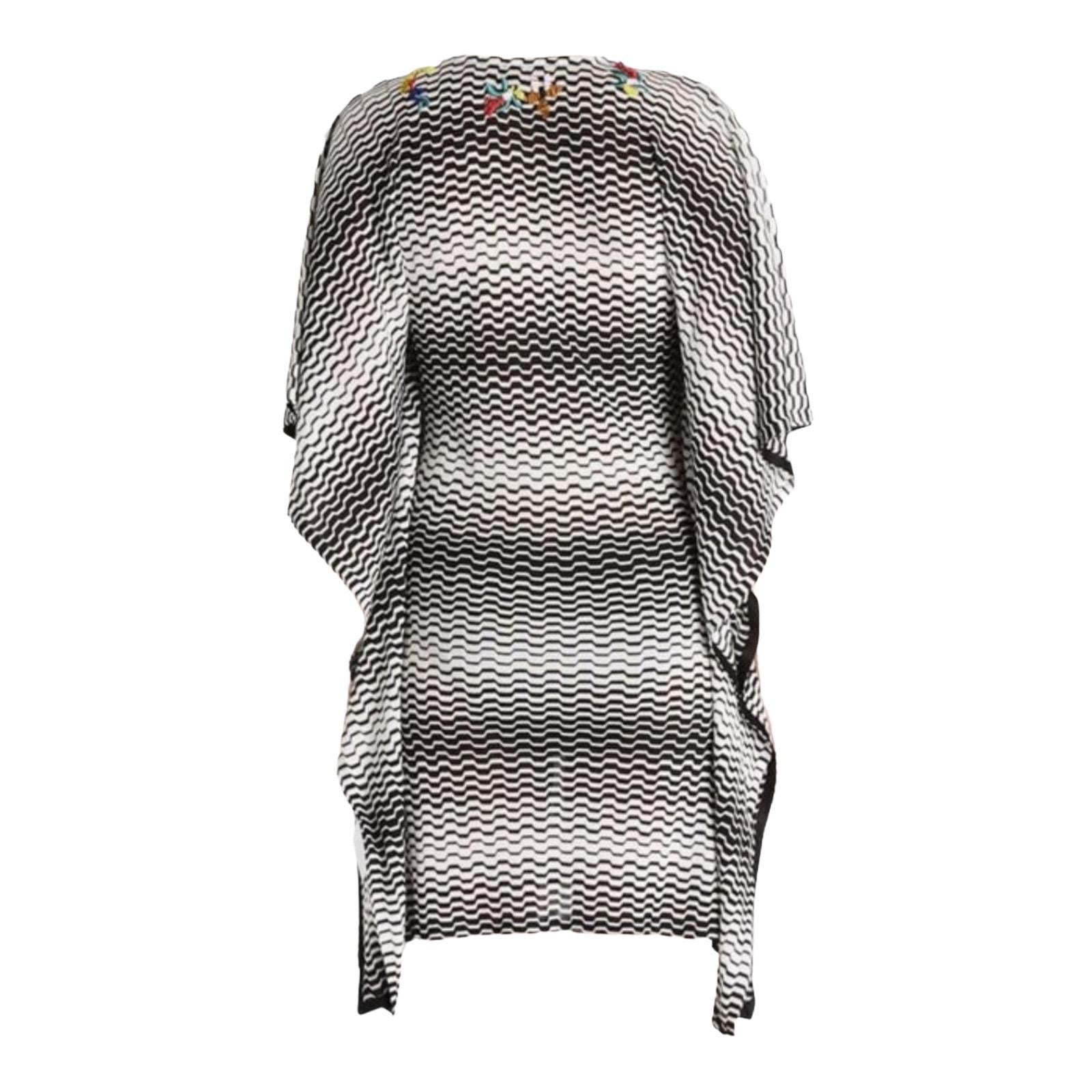 
Missoni's kaftan has been crafted in Italy using the label's signature crochet-knit technique. This piece is so versatile, its relaxed shape makes it perfect for slipping on over a bikini or to wear it as a casual dress or over a leggings or