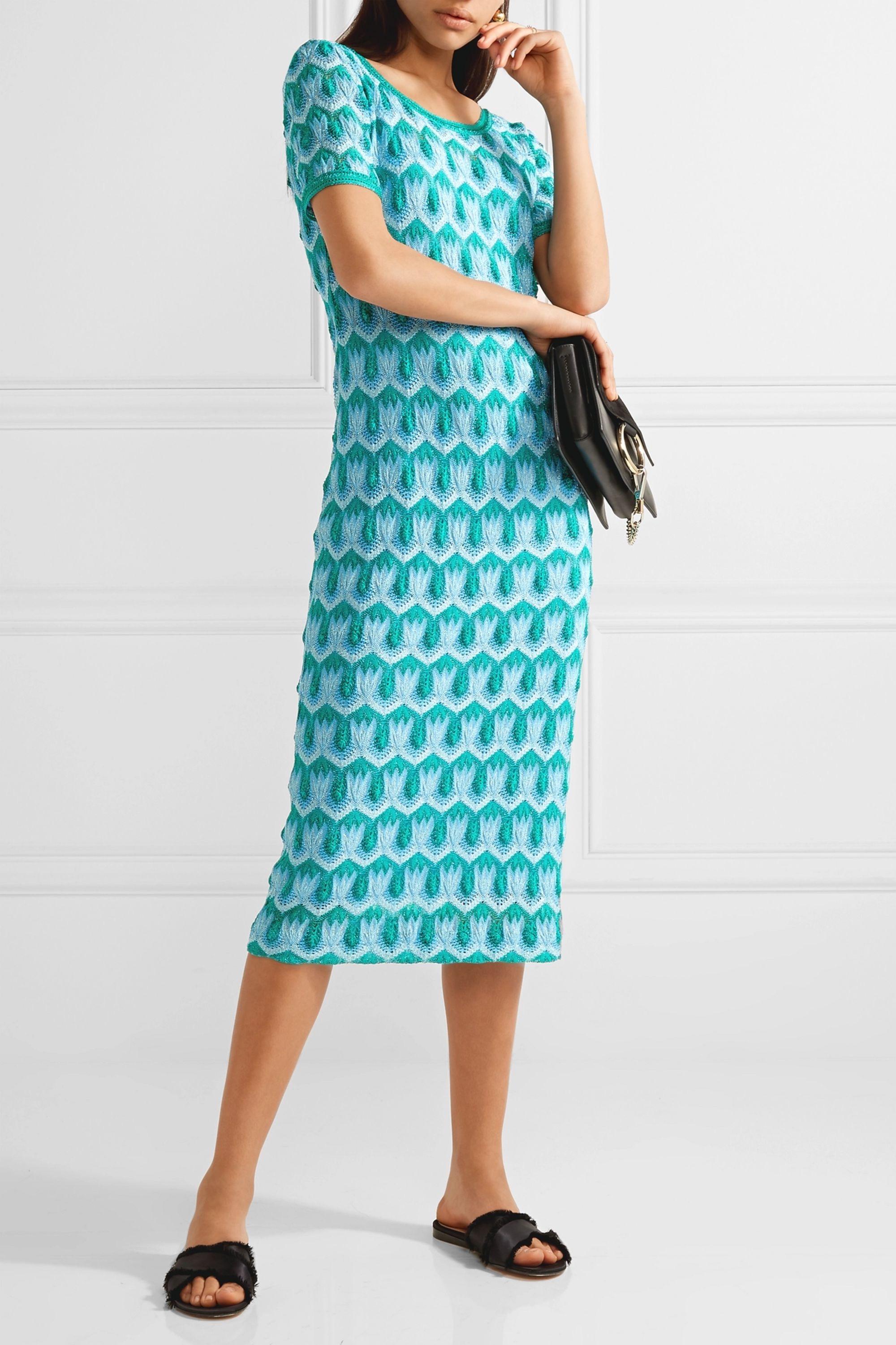 Angela Missoni's tactful approach to color and texture never ceases to amaze season after season. Threaded with metallic yearns, this fitted dress is made from the brand's signature crochet-knit in oceanic hues and lined through the body for