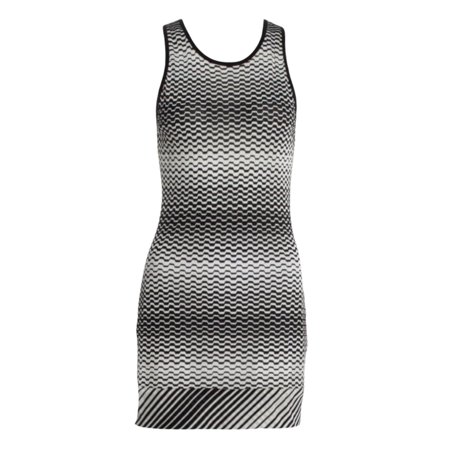 
Missoni's monochrome striped dress has been crafted in Italy using the label's signature crochet-knit technique. The amazing shape makes it perfect for slipping on over a bikini or to dress it up with heels for a night out.


Missoni signature