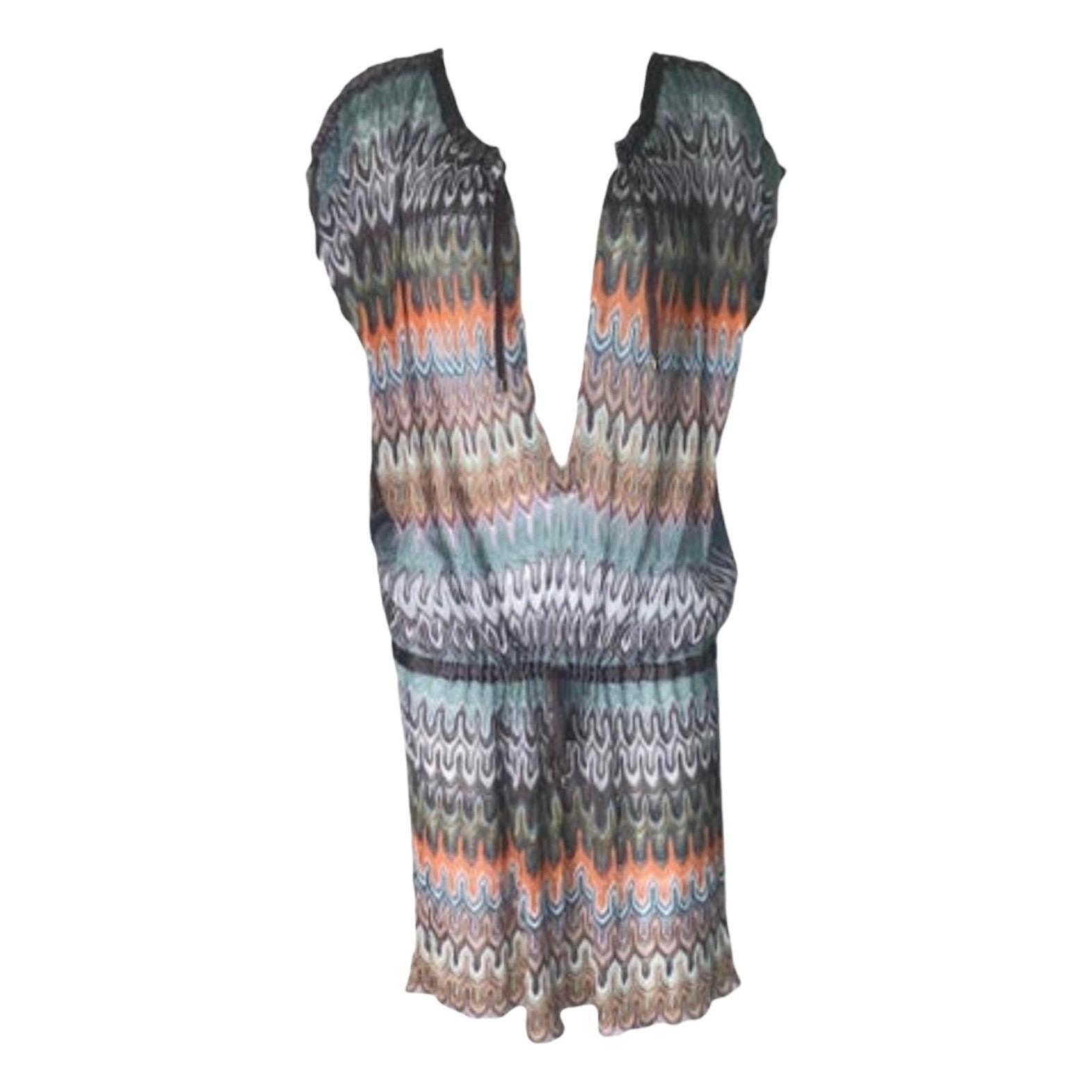 Missoni's multicolored zig-zag crochet-knit tunic with gathered waist perfectly embodies bohemian luxe style. Layer it over a slip with a hat and leg-lengthening wedge heels for a chic vacation look.

This colorful Missoni signature crochet-knit