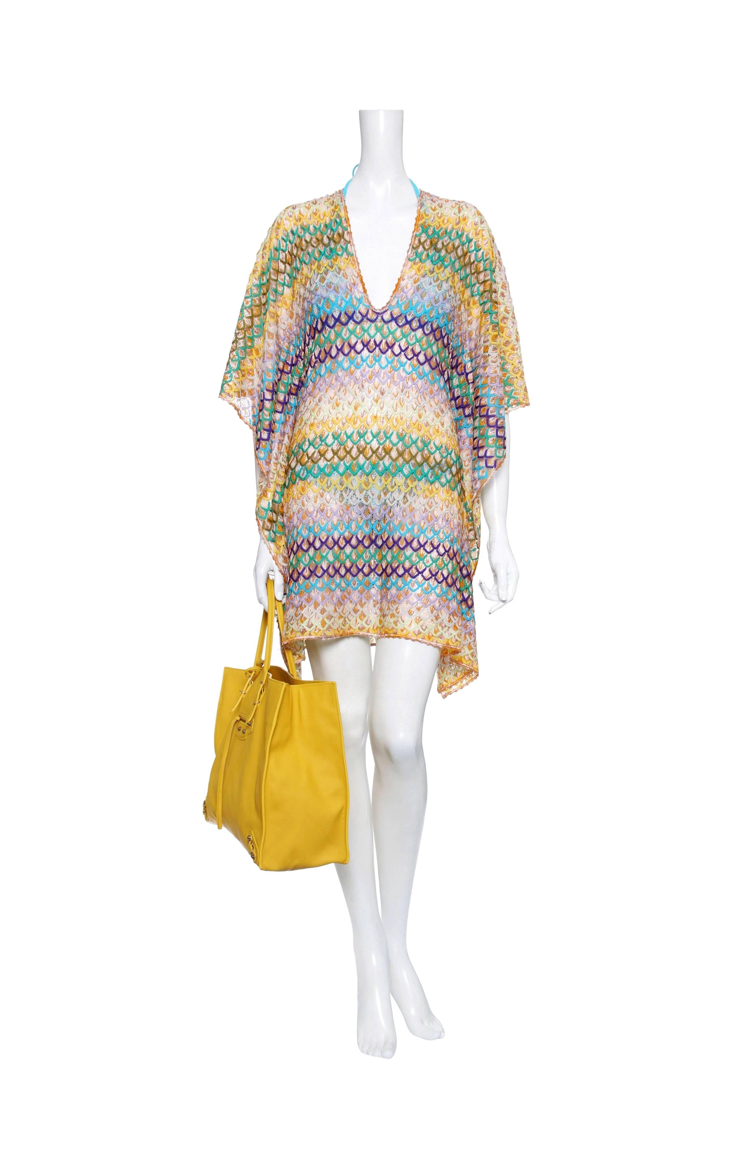 A signature Missoni Mare knit caftan in a rainbow of colors is the only coverup you'll need this Resort season

Multicolored knitted kaftan with wave pattern
Fish scale knit
Plunging V-neckline.
Short kimono sleeves
Simply slips on
Made in