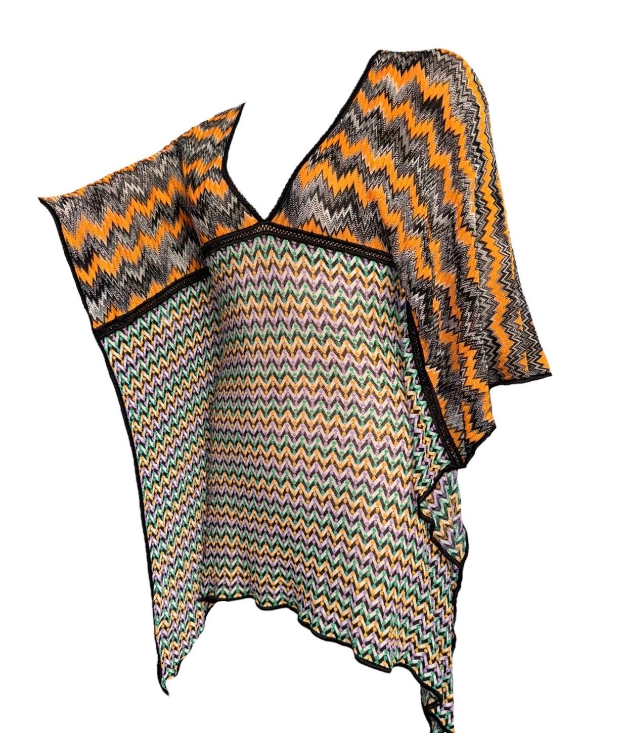Missoni crochet-knit kaftan is cut for a stunning fit that's perfect for hot days by the pool. Offset the instantly recognizable zigzag pattern with a block-color swimsuit in a tonal shade
A signature Missoni knit caftan in a cascade of colors is