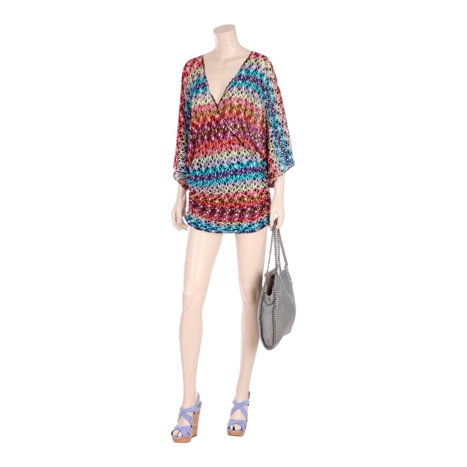 A Missoni signature piece in stunning colors
Stunning, rare piece - hard to find!
Multicolored crochet-knit
Deep V-neck
Wrap style
Batwing sleeves
Simply slips on
Made in Italy 
Dry Clean Only
Size 40