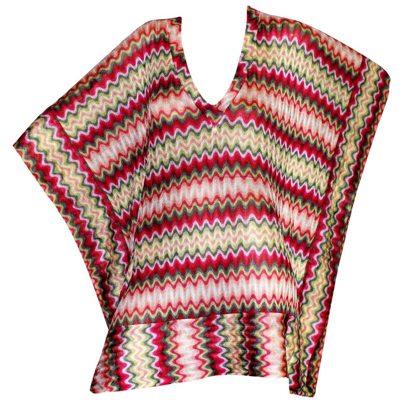 Missoni chevron pattern decorates this multicolored coverup. A vacation must-have, it's crafted using the Italian house's signature crochet-knit. Lightweight and oversized, it's the perfect choice for poolside lounging. So versatile, that it can be