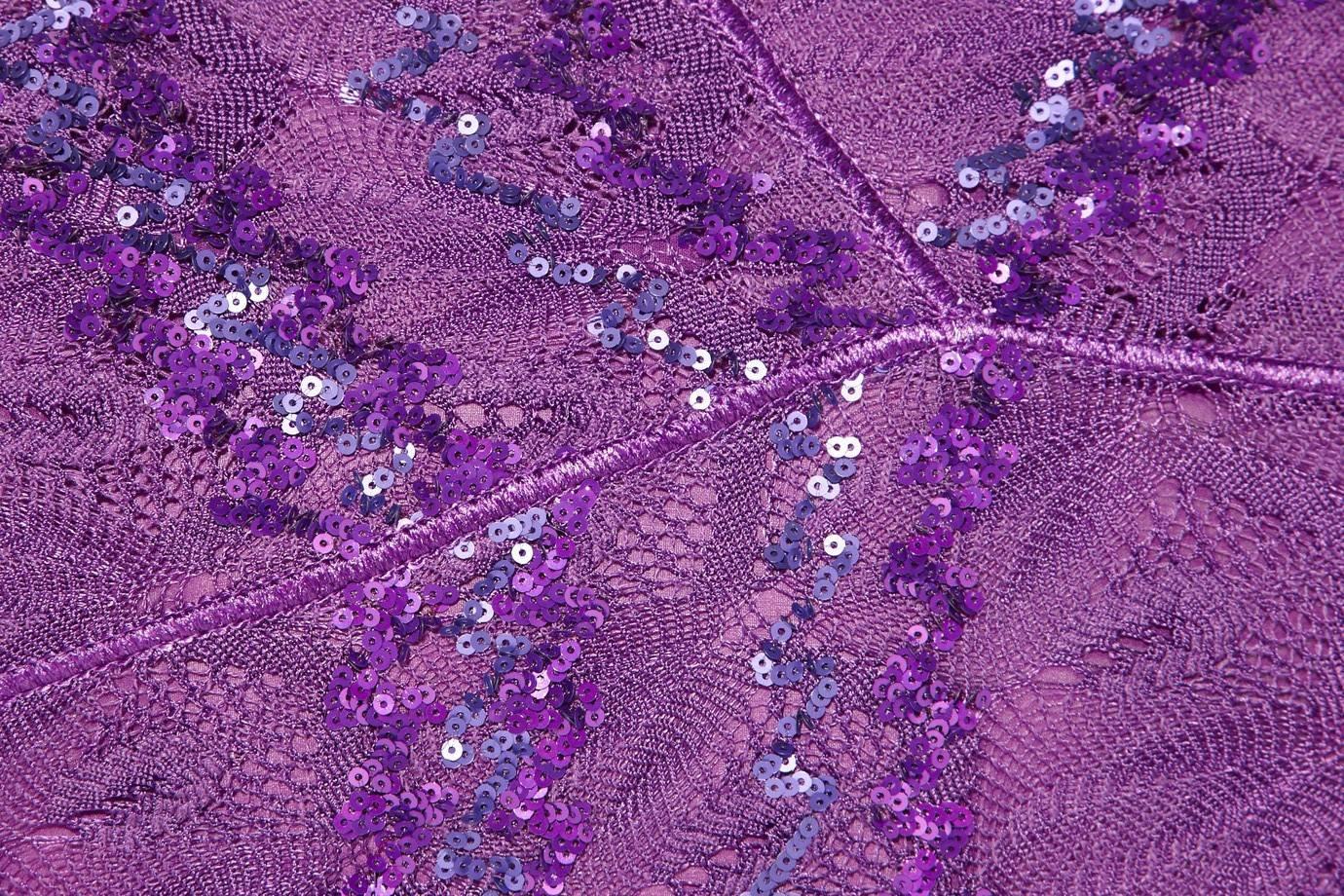 A very elegant sequined crochet-knit gown in Missoni's signature crochet knit fabric
Gorgeous piece, perfect for a classy evening 
Stunning purple color, embroidered with beautiful shiny sequins.
The dress is fully lined
Boned corset on the inner