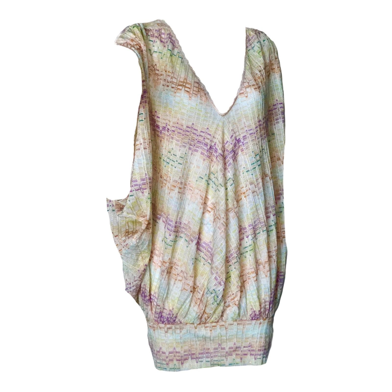 Missoni's multicolored crochet-knit kaftan makes a chic addition to your getaway wardrobe. Wear it over a metallic bikini poolside or on its own with heeled gladiator sandals.

Multicolored crochet-knit kaftan dress
Deep V-neck
Wide draped