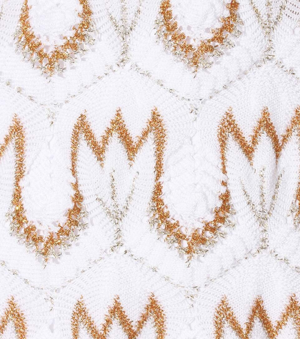 Missoni's stunning, classy kaftan has been crafted in Italy using the label's signature crochet-knit technique. The relaxed shape makes it perfect for slipping on over a bikini.

 Missoni Mare's white cotton-blend kaftan is embroidered with gold