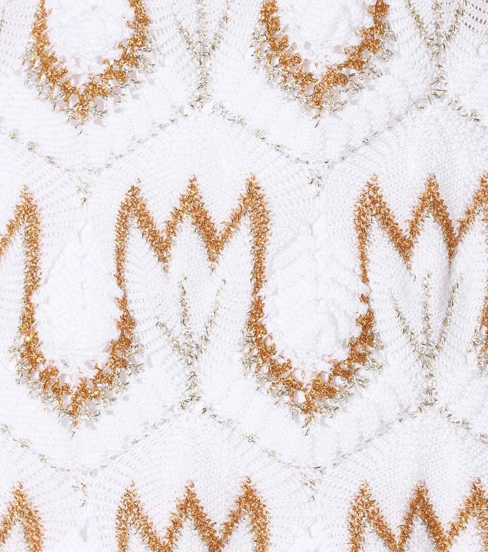 Missoni's stunning, classy kaftan has been crafted in Italy using the label's signature crochet-knit technique. The relaxed shape makes it perfect for slipping on over a bikini.

 Missoni Mare's white cotton-blend kaftan is embroidered with gold