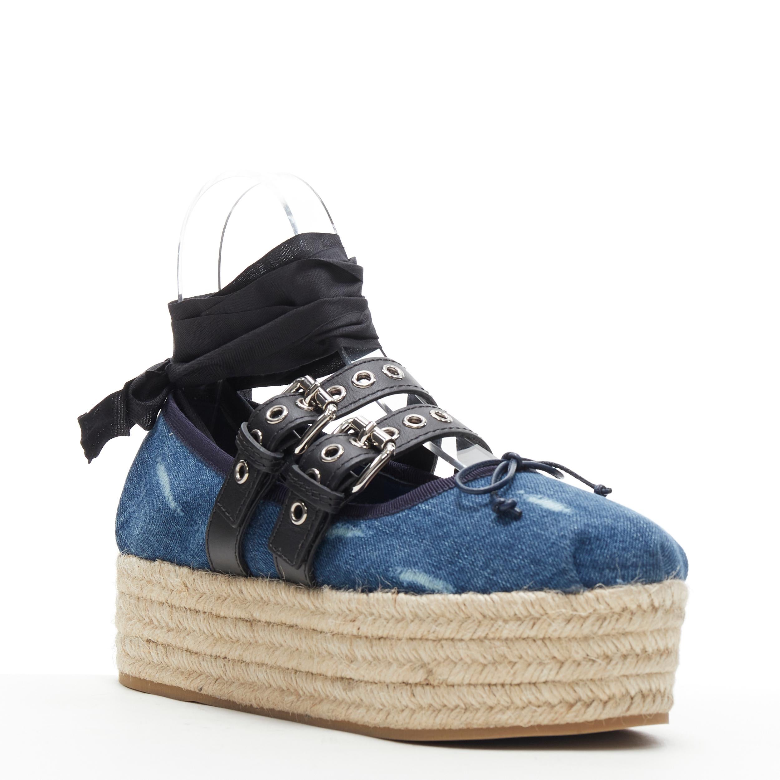 new MIU MIU blue denim espadrille platform punk ribbon lace ballerina flats EU38 
Reference: TGAS/B00844 
Brand: Miu Miu 
Designer: Miuccia Prada 
Model: Blue platform ballerina espadrille 
Collection: 2017 Runway 
Material: Denim 
Color: Blue