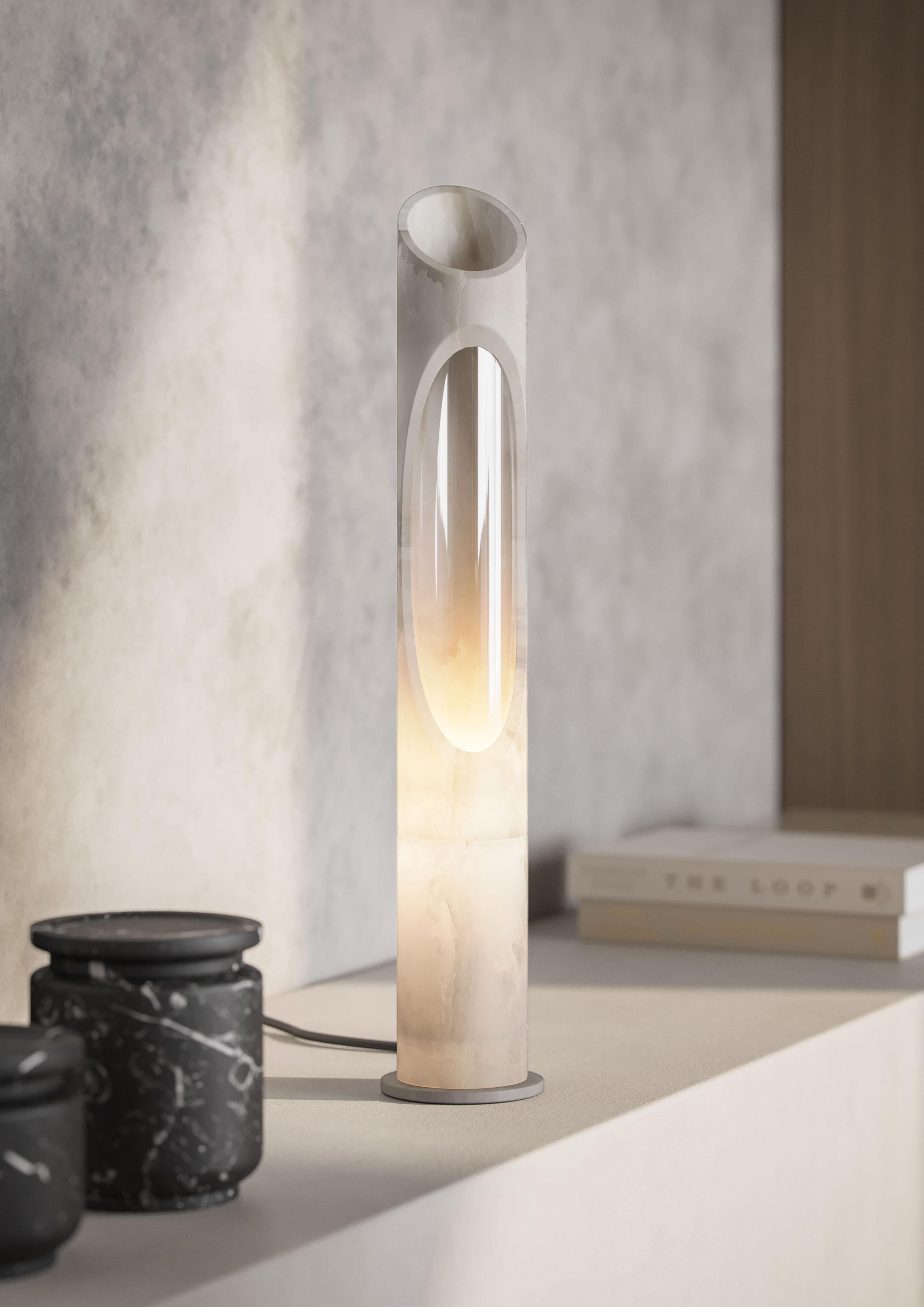 Lamp S in White Onyx Egeo marble, designed by Jacopo Simonetti.
Available also in Pink Egeo, White Arabescato, Black Marquinia marble and in the L version. 

Armonia Collection: Inspired by the captivating image that two contrasting elements can