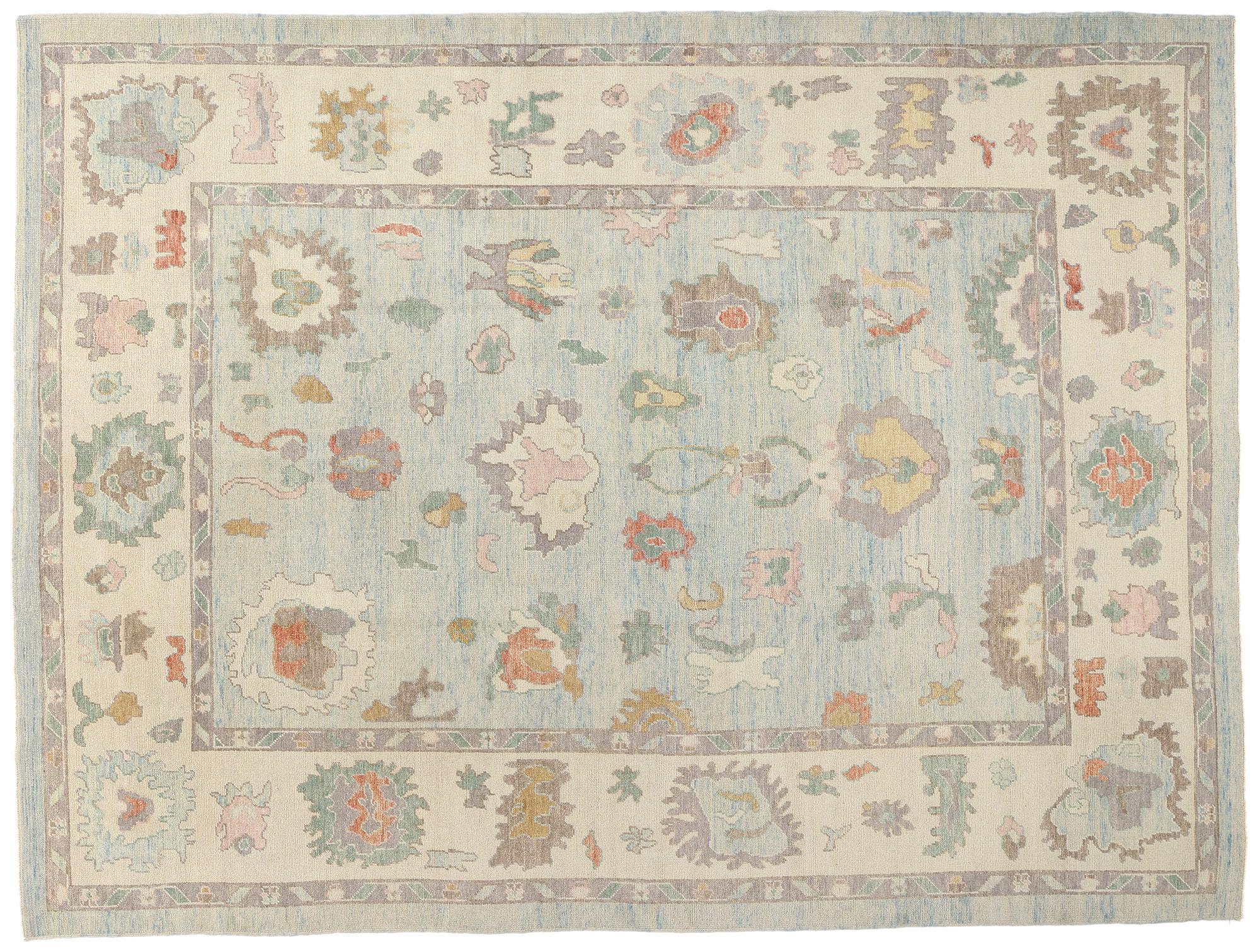 53950 New Modern Light Blue Turkish Oushak Rug, 10'09 x 14'01. This hand knotted wool modern Turkish Oushak rug, crafted with a passion for both tradition and contemporary aesthetics, presents a serene yet lively tableau on a light blue field. The