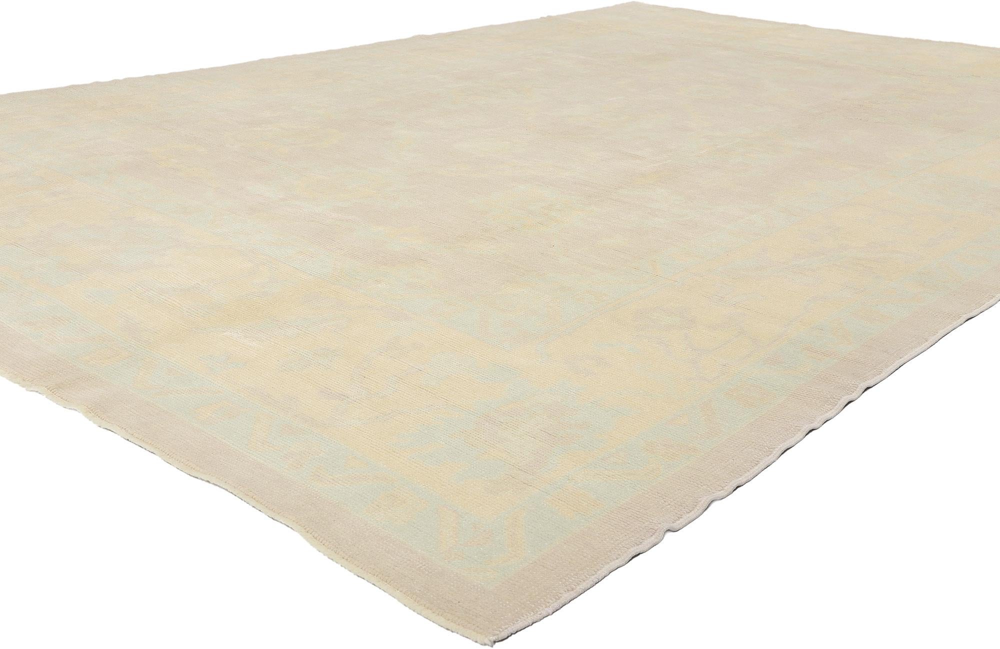 53161 Modern Muted Turkish Oushak Rug, 09'03 x 13'07. Like morning light brushing softly across ancient Anatolian hills, this hand-knotted wool modern Turkish Oushak rug whispers rather than shouts. Woven in a symphony of hushed tones—muted
