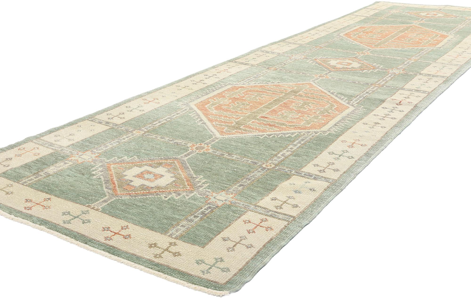 53983 New Modern Green Turkish Oushak Rug Runner, 03'10 x 13'04. This hand-knotted wool modern Turkish Oushak rug runner is a stunning embodiment of tribal enchantment and nomadic charm. Its soft earth-tone palette, featuring hues of sage green,