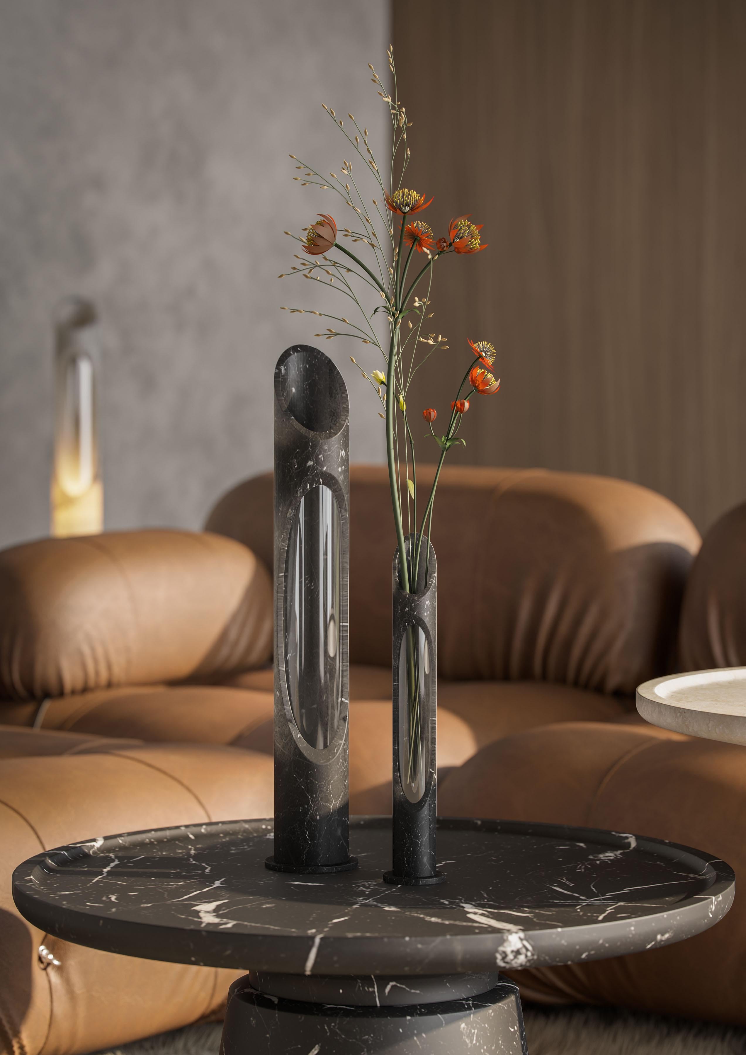 Vase S in Black Marquinia marble, designed by Jacopo Simonetti.
Available also in Pink Egeo, white onyx, White Arabescato marble and in the L version. 

Armonia Collection: Inspired by the captivating image that two contrasting elements can