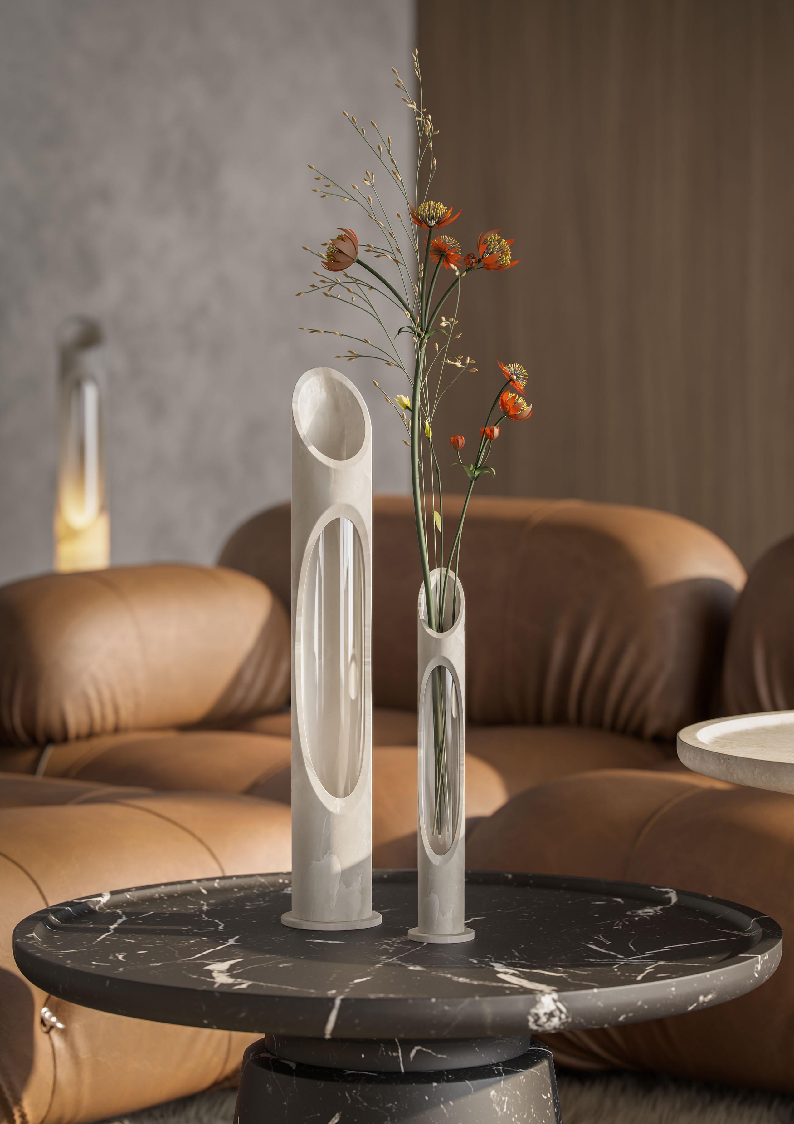 Vase S in White Onyx marble, designed by Jacopo Simonetti.
Available also in Pink Egeo, Black Marquinia, White Arabescato marble and in the L version. 

Armonia Collection: Inspired by the captivating image that two contrasting elements can