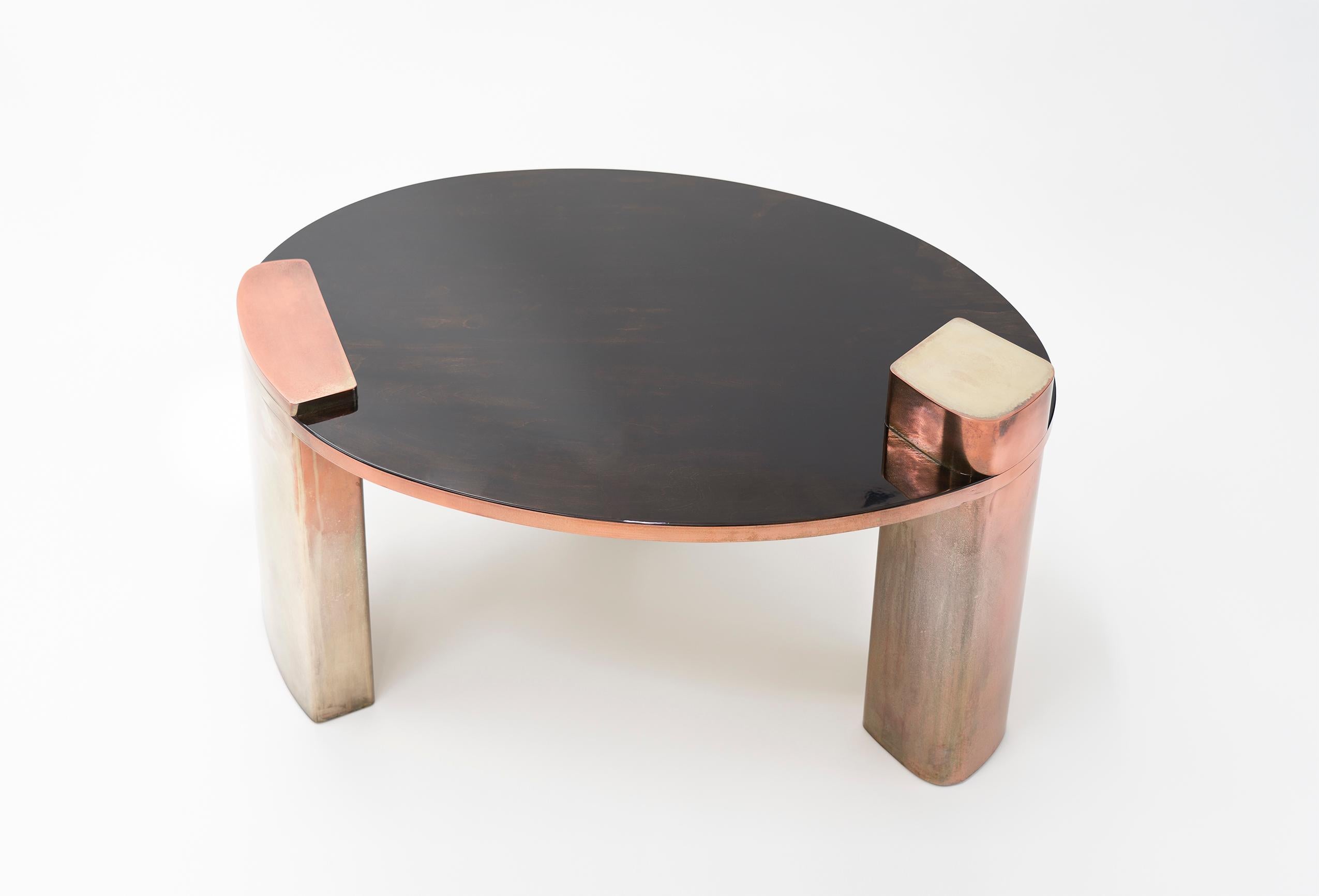 New Moon–21st century lacquered mahogany and silvered copper luxury low table

Our attraction to the Moon is not slighter than the witnessed obsession with our pale satellite from the fading past to every new sunset reborning. Our last table from